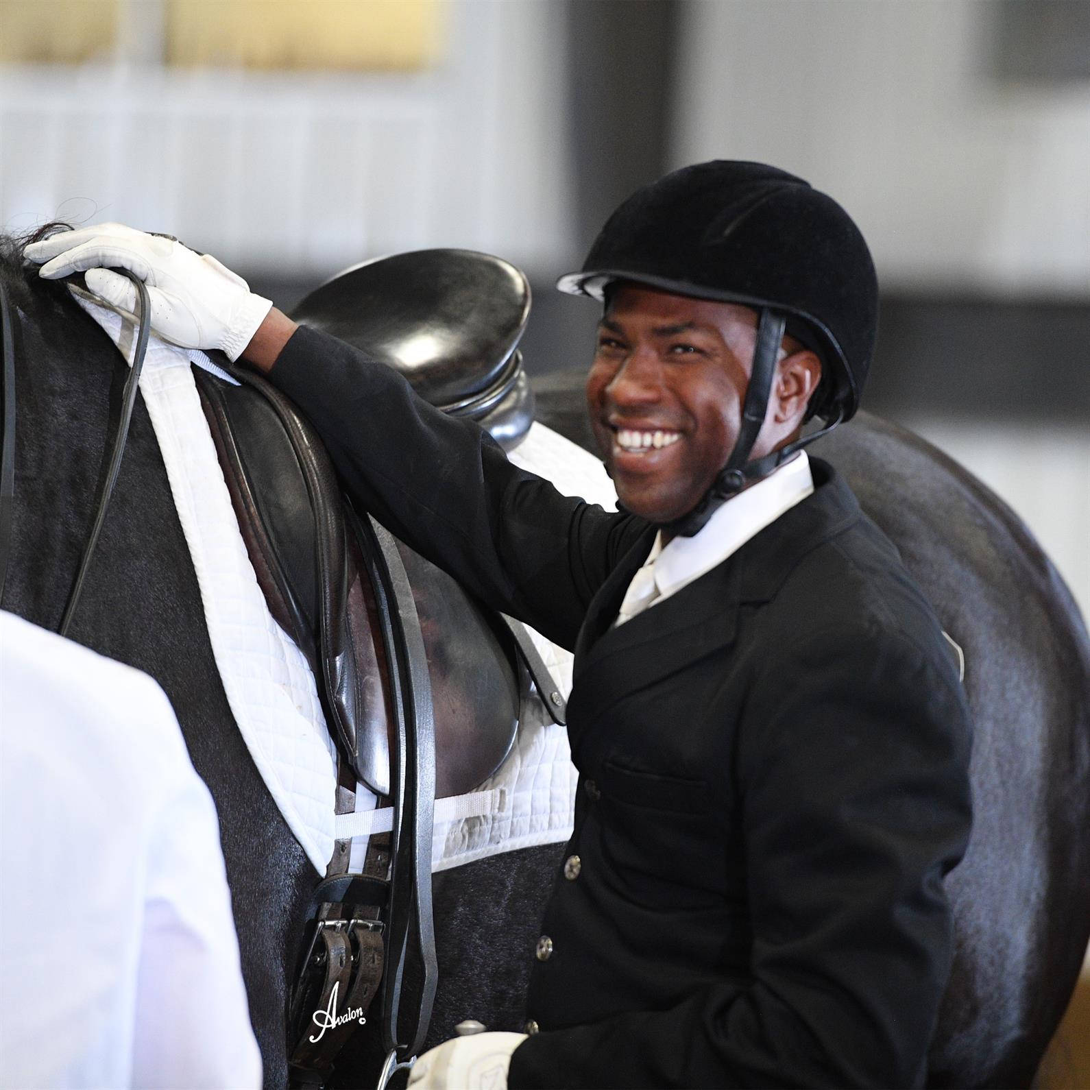 Skilled Equestrian Demonstrates Control And Partnership Background