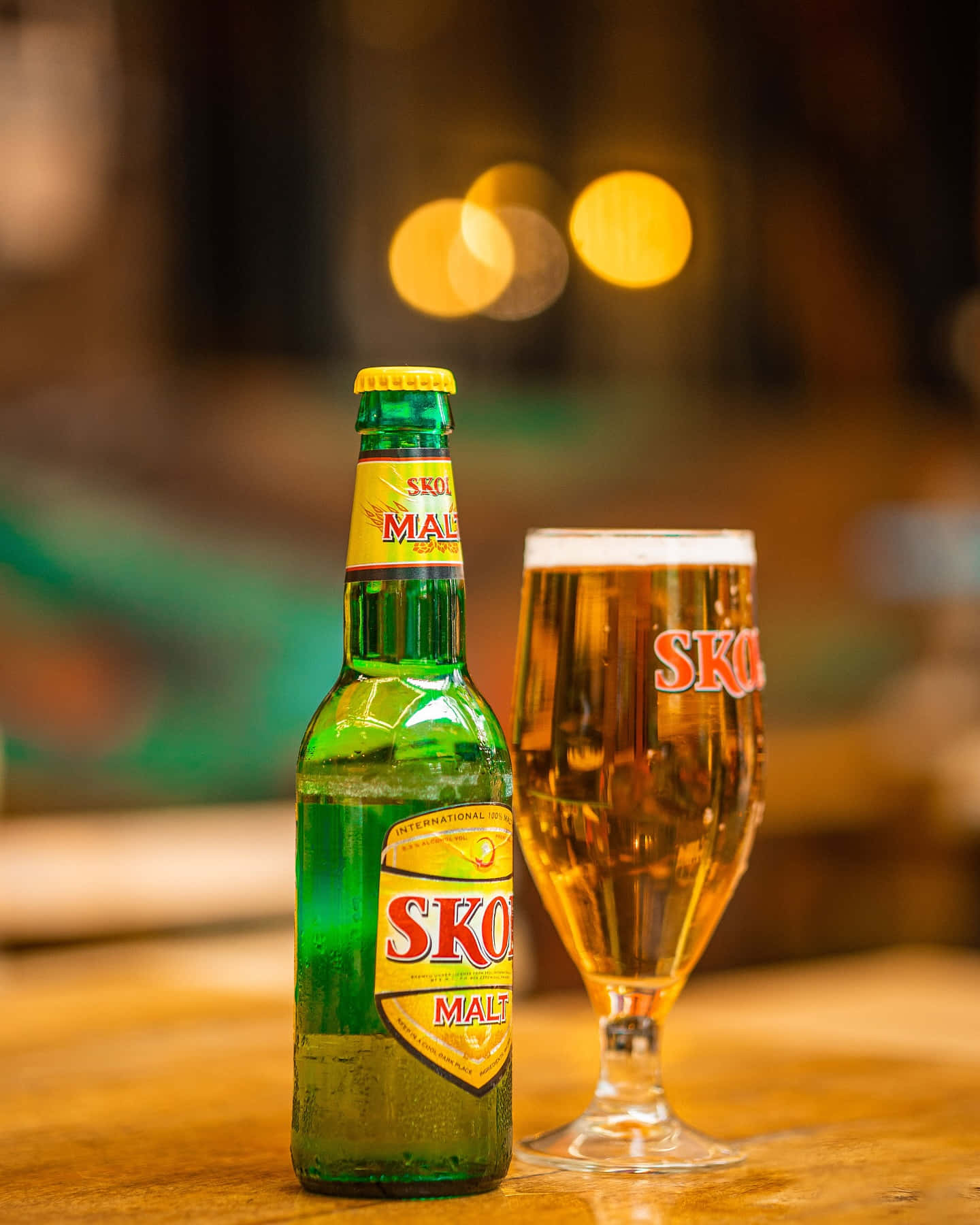 Skol Beer Bottleand Glass Background