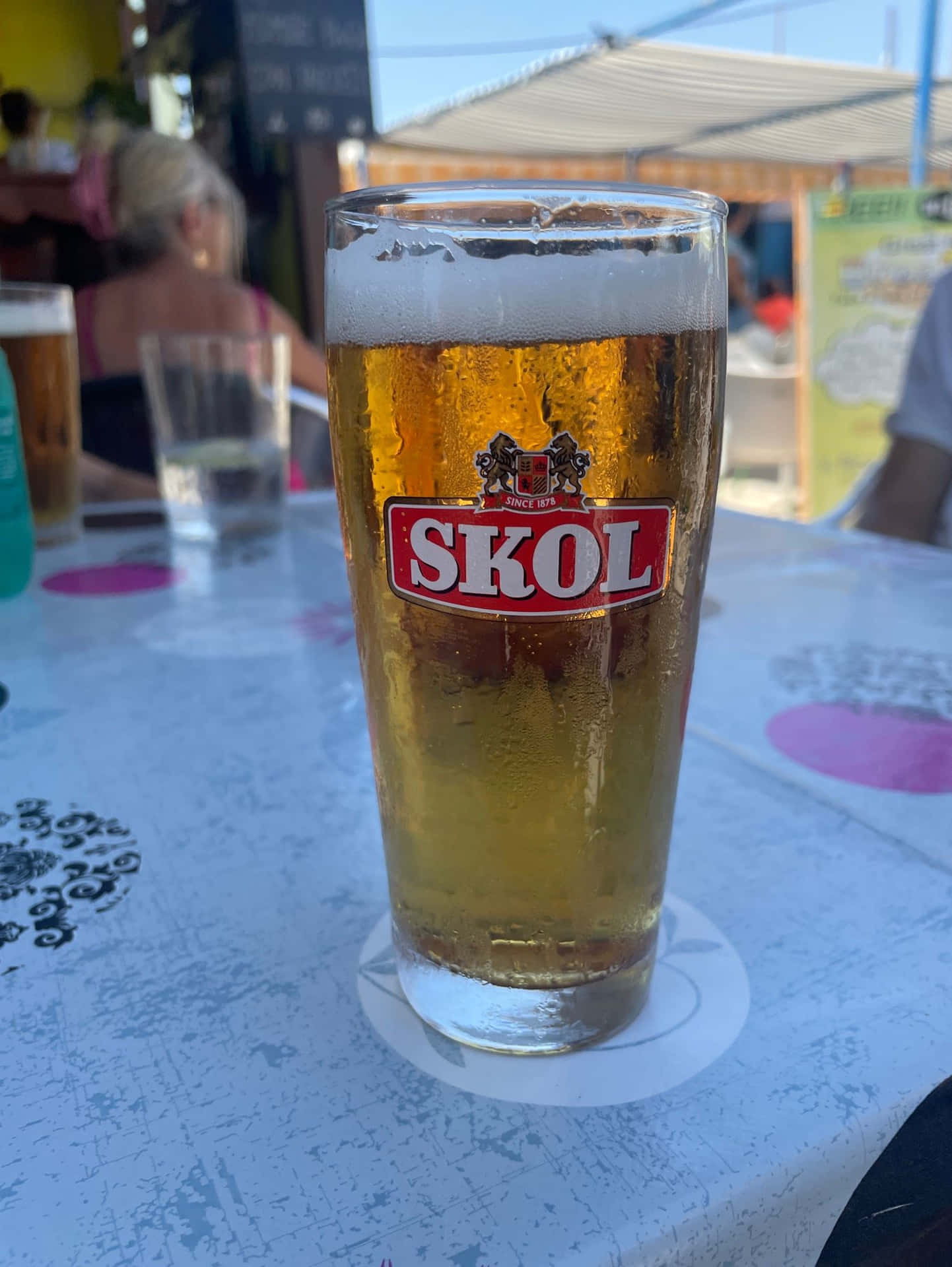 Skol Beer Glasson Table Background