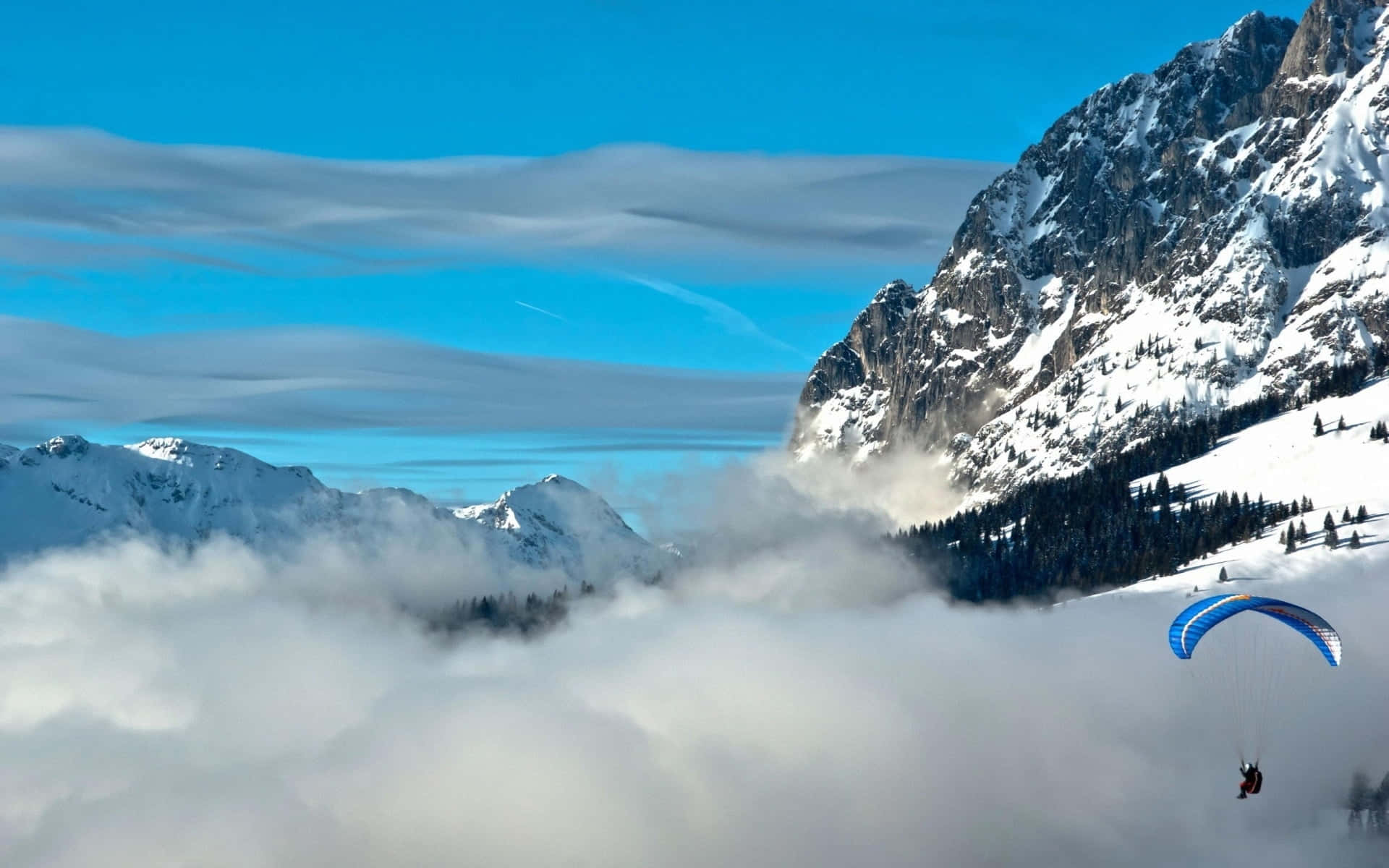 Skydiving On Rocky Mountain Background