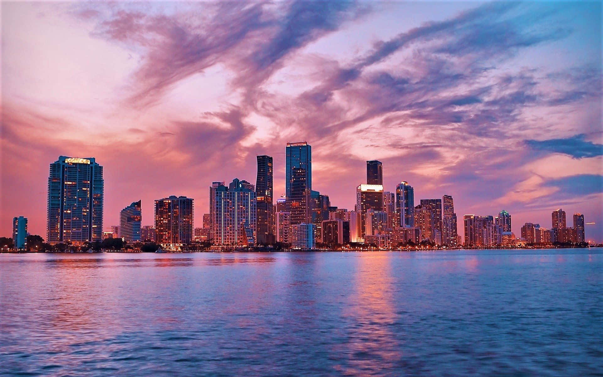 Skyline With Pink Clouds Background