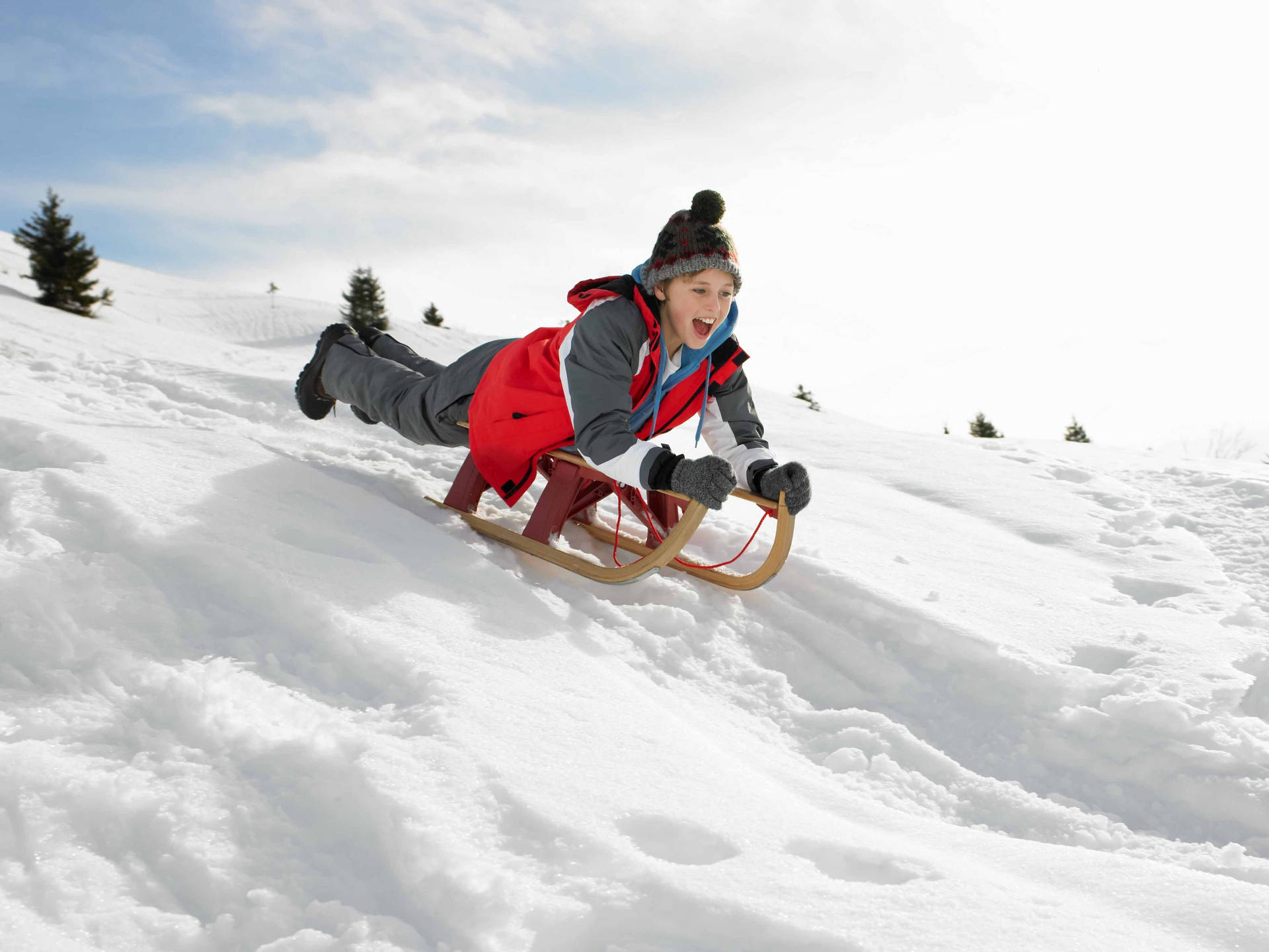 Sledding Down The Snowhill Background