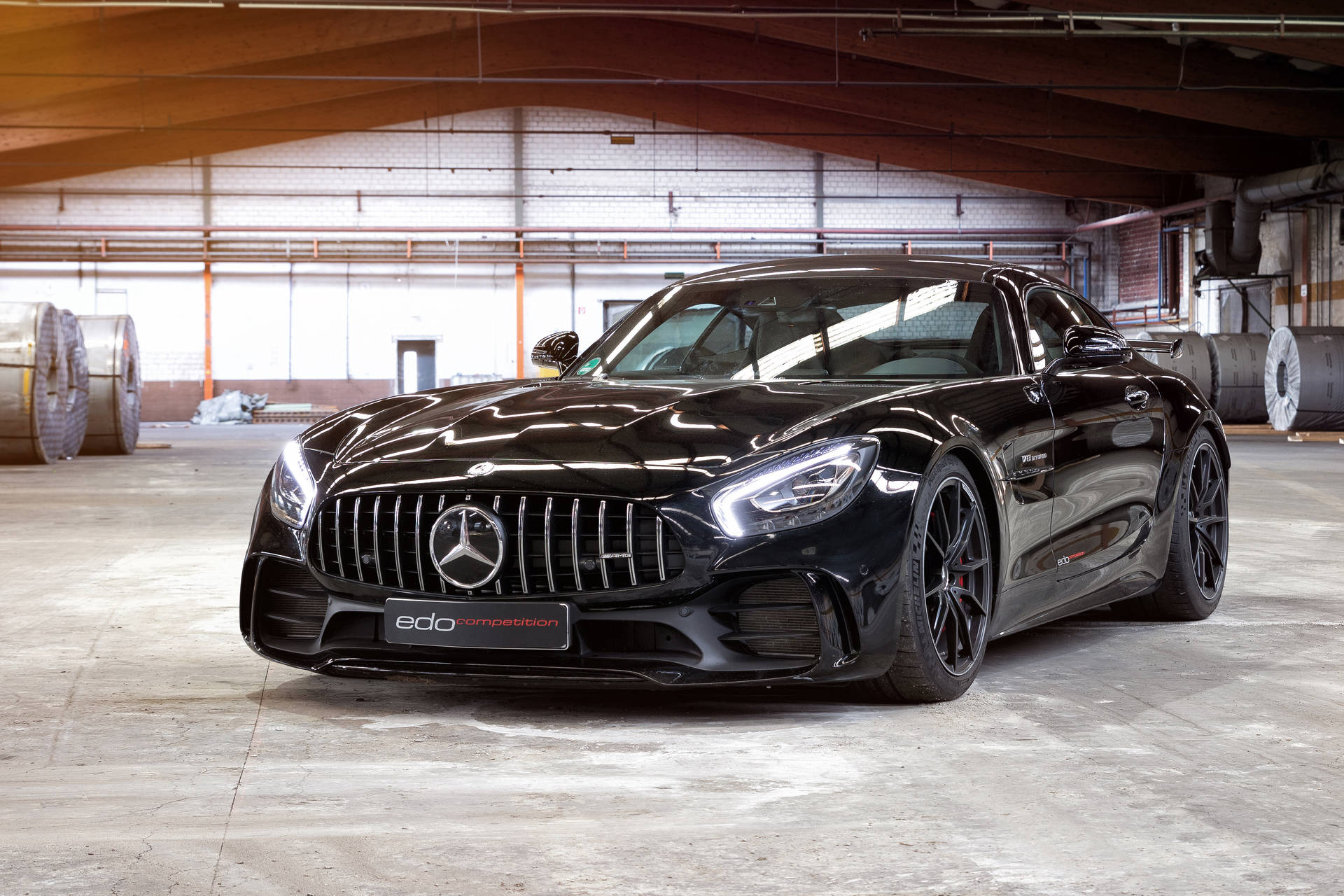 Sleek And Luxurious Black Amg Gtr Showcasing Absolute Power And Class Background