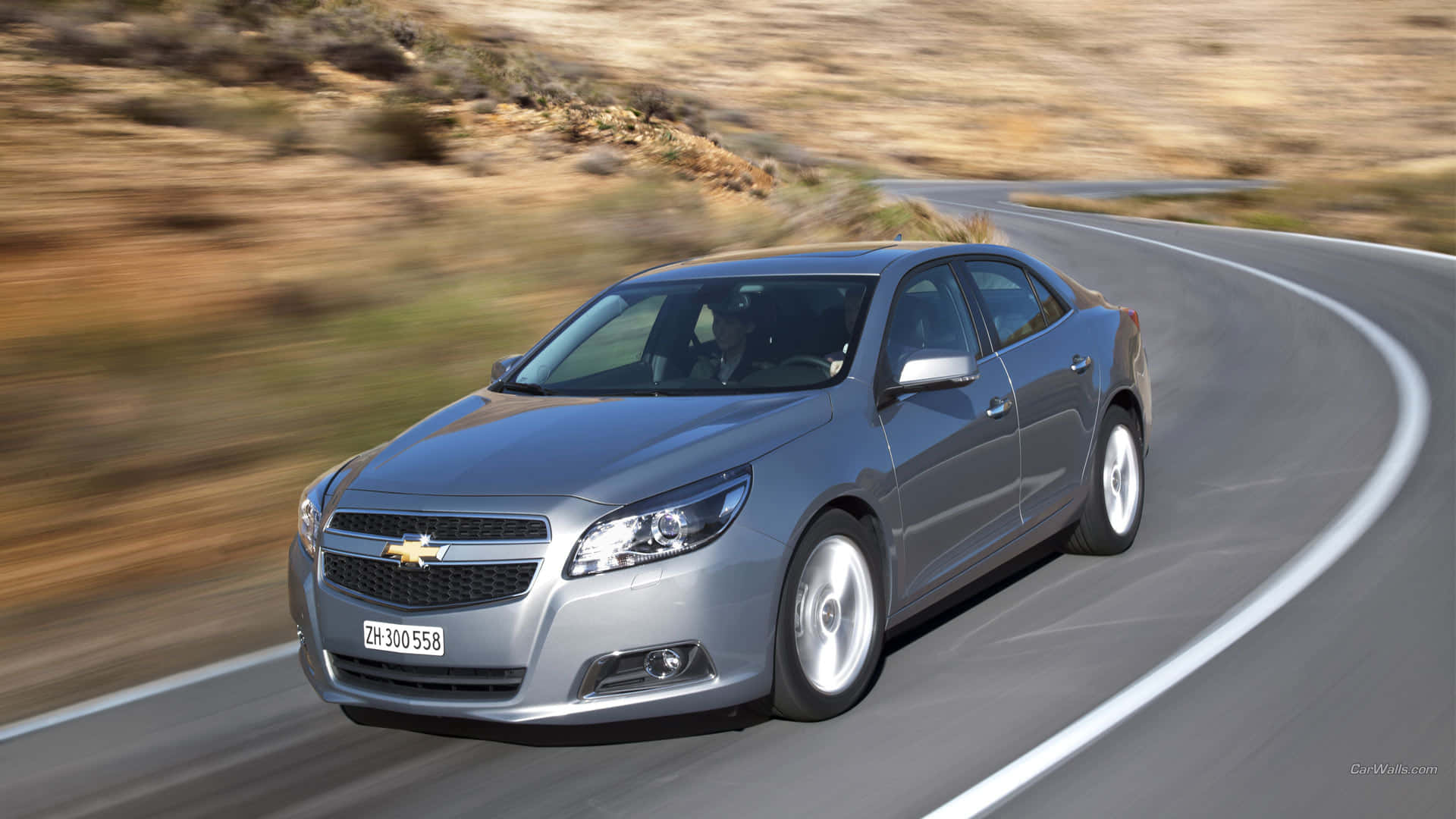 Sleek And Modern Chevy Malibu Cruising Background