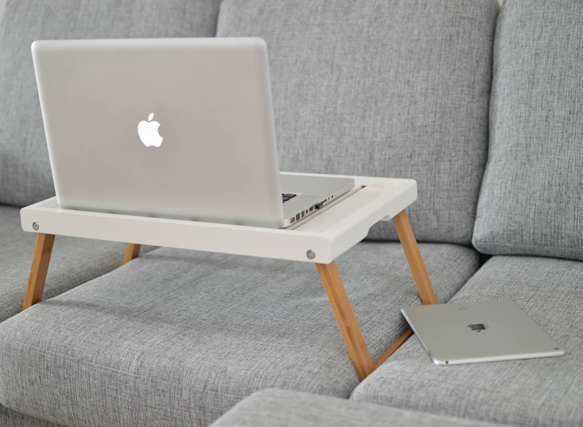 Sleek Apple Macbook Pro On A Wooden Surface Background