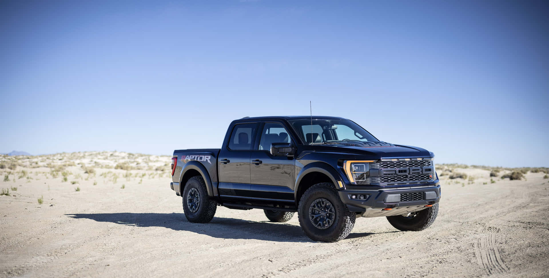 Sleek Black Ford F 150 Raptor R Background