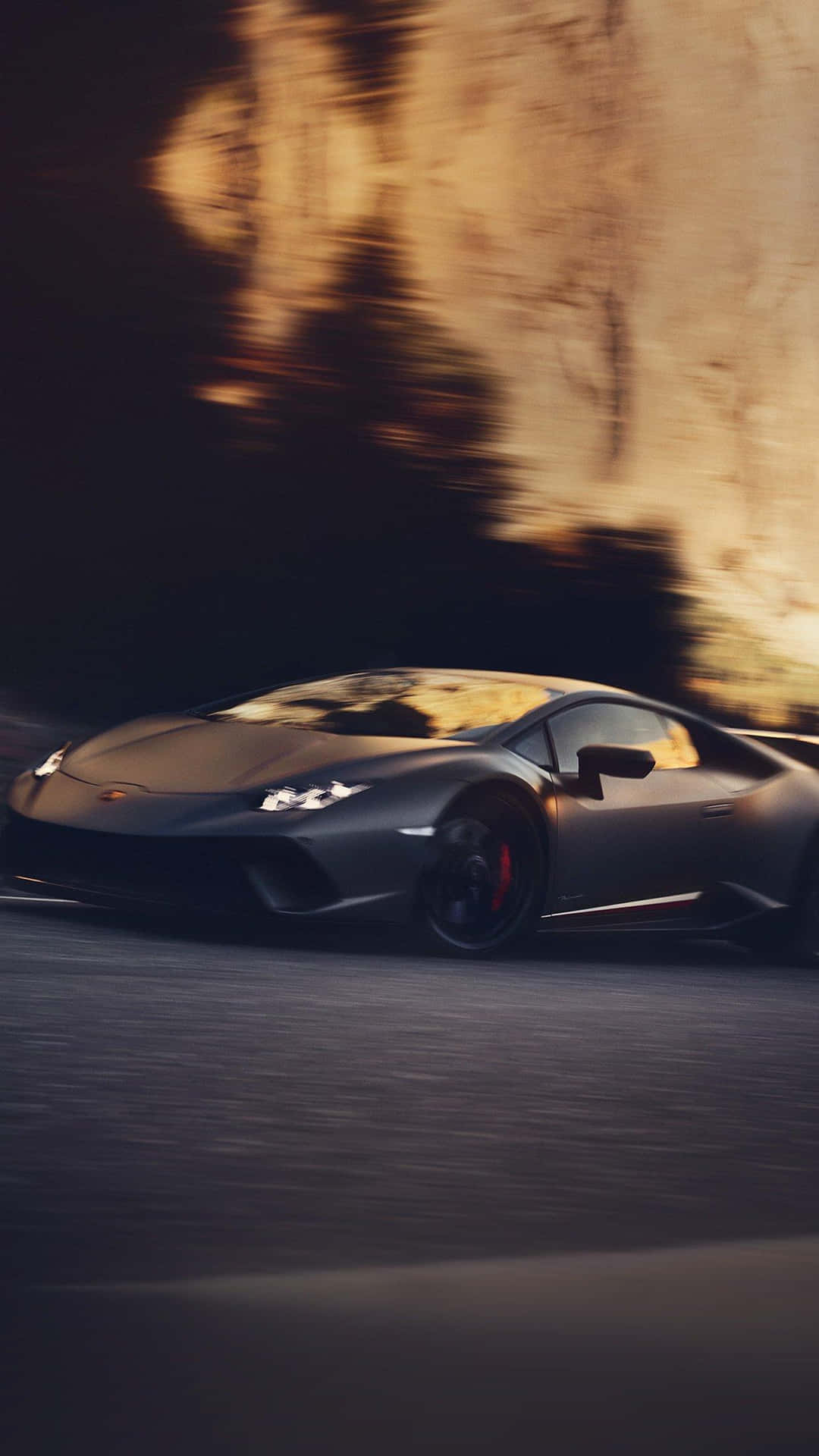 Sleek Black Lamborghini In A City Landscape Background