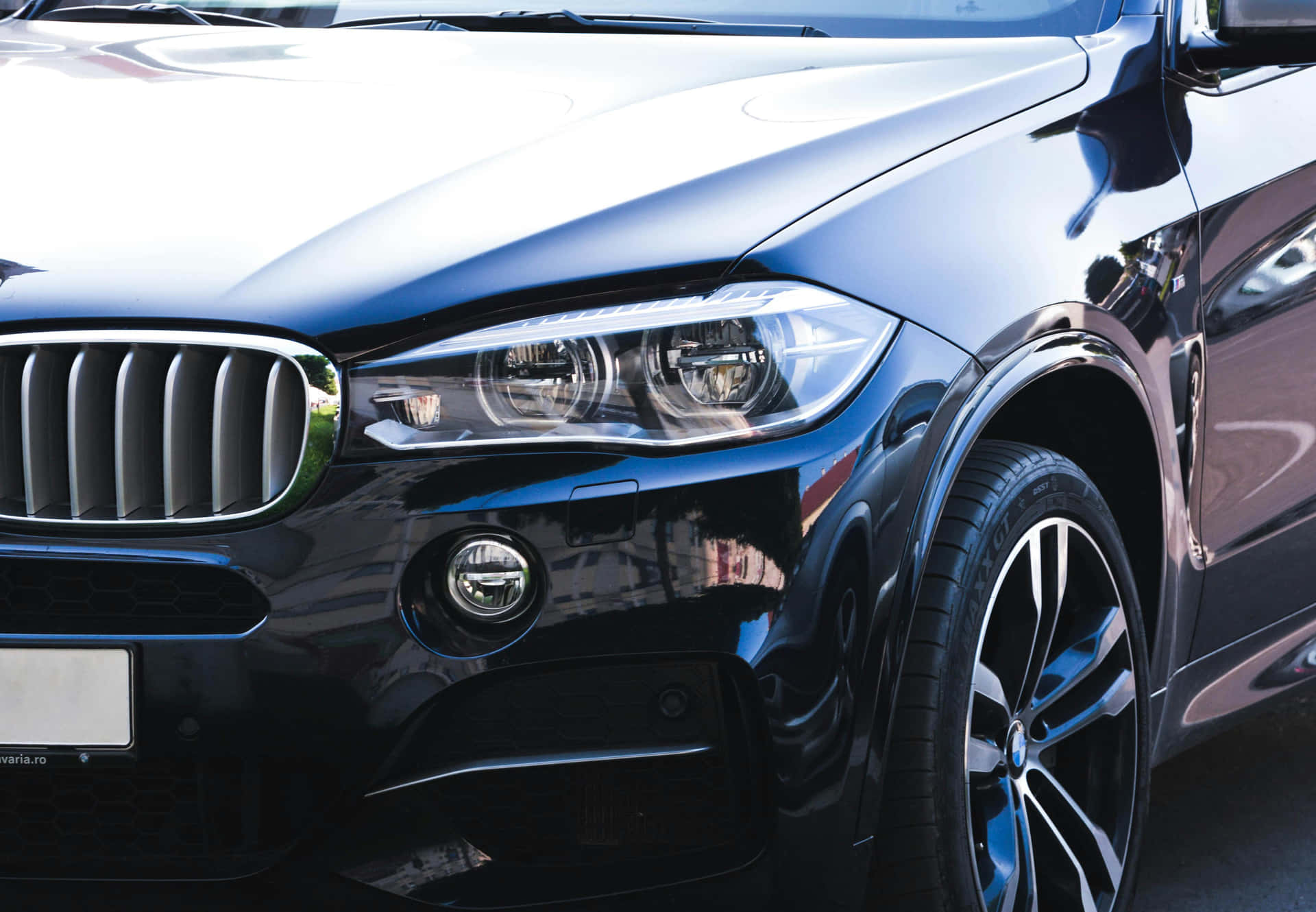 Sleek Black Luxury Car Closeup Background