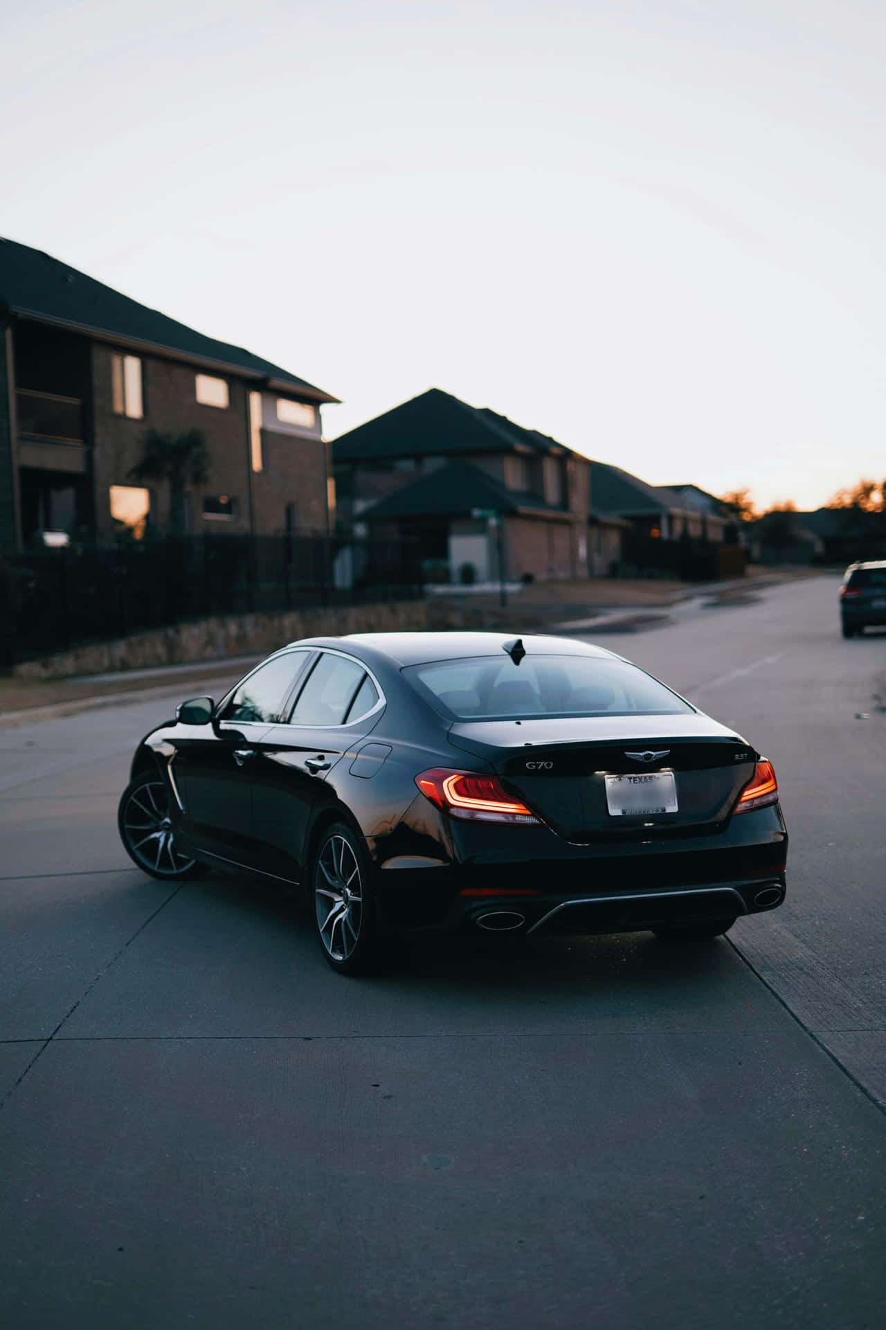 Sleek Black Sedan At Dusk