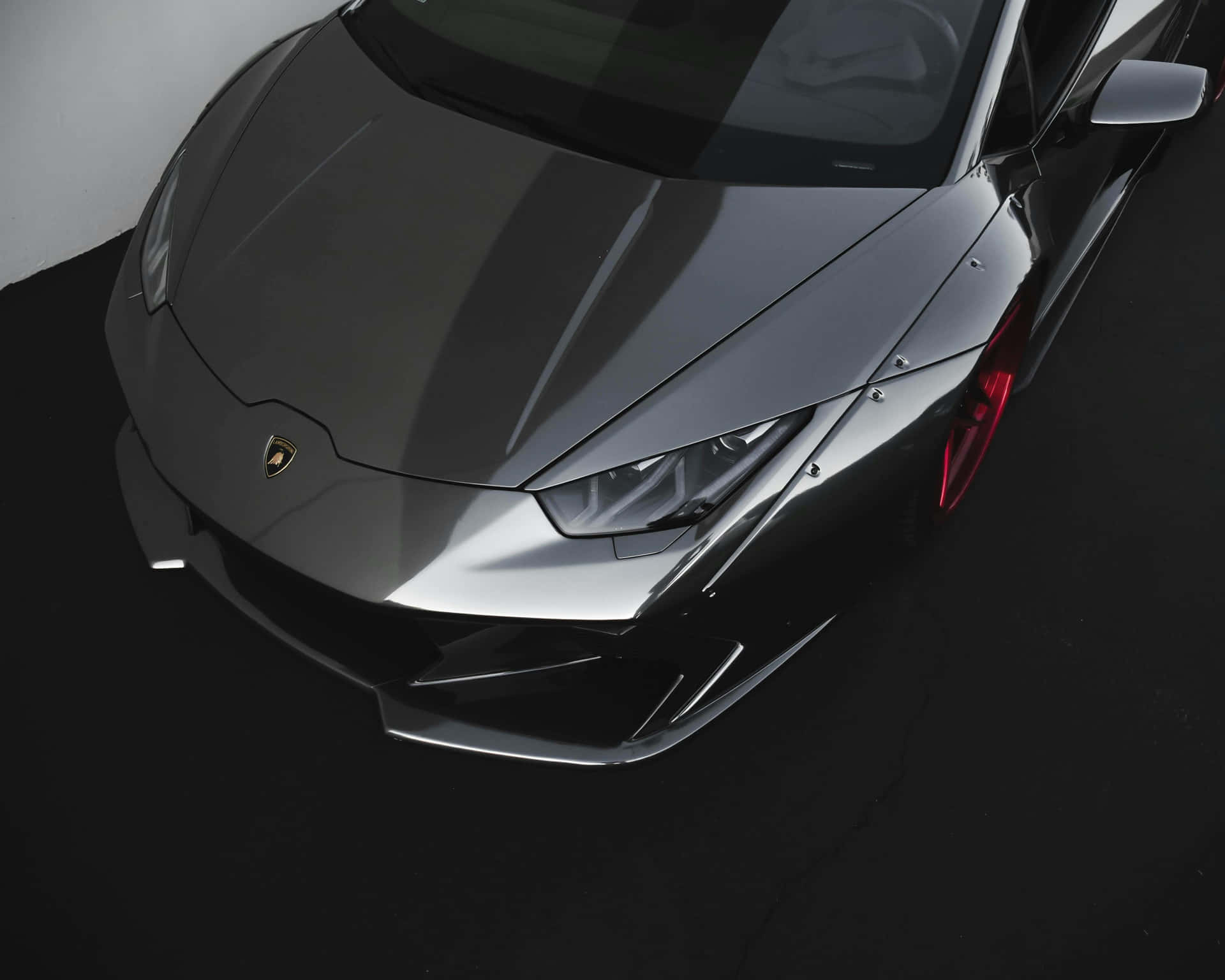Sleek Black Sports Car Aerial View Background