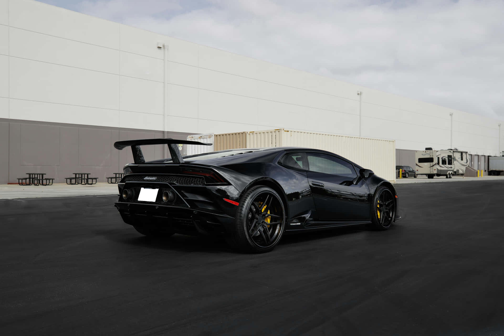 Sleek_ Black_ Sports_ Car_ Parked_ Outdoors.jpg Background