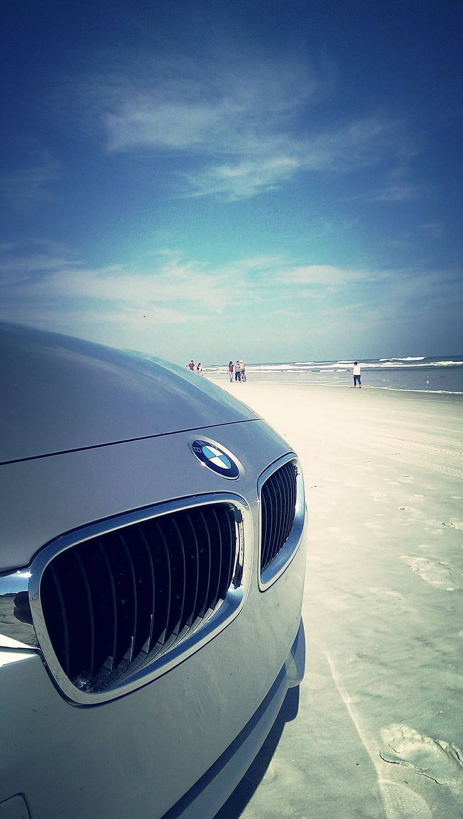 Sleek Bmw Coupe On The Road Background