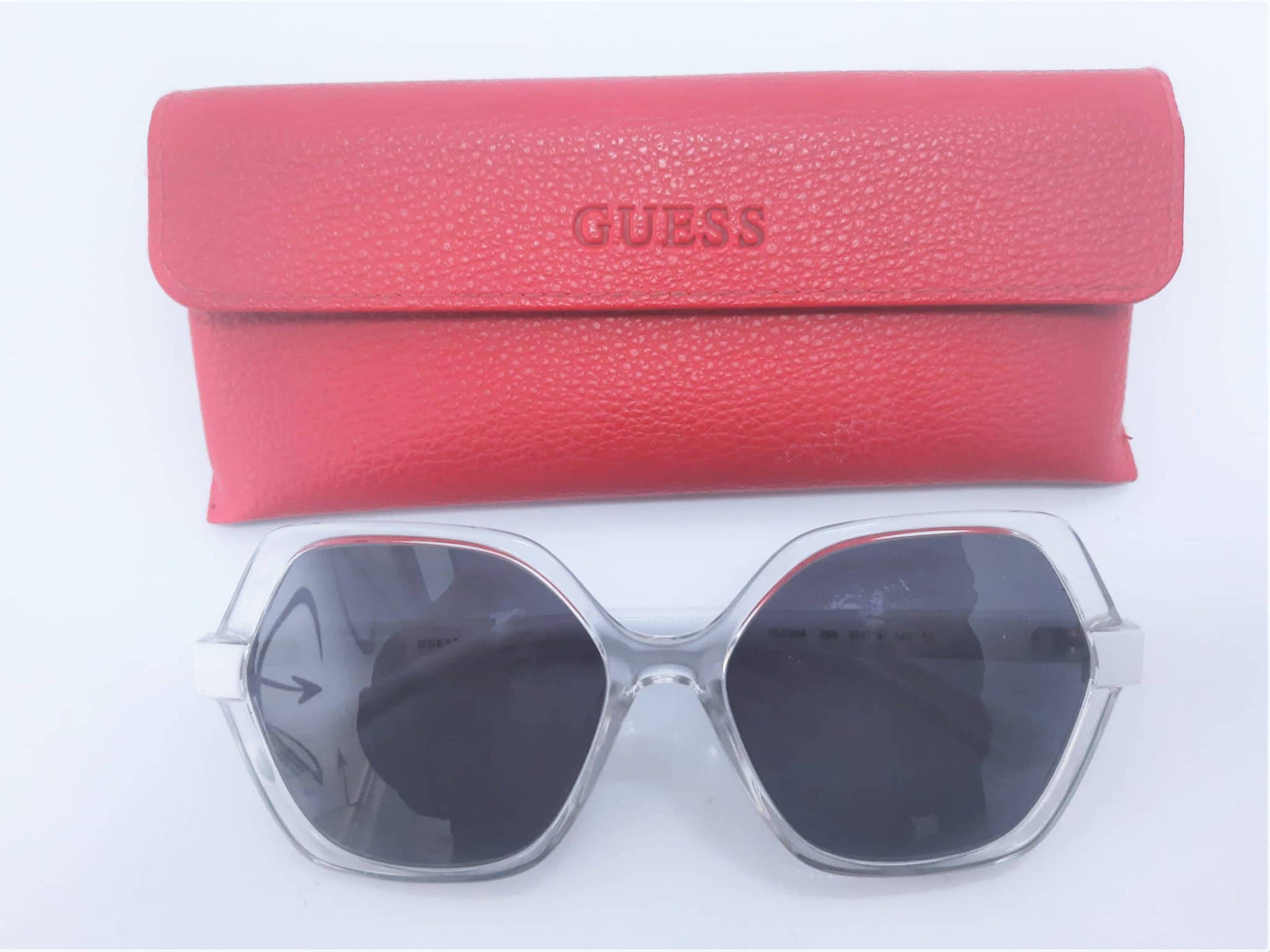 Sleek Clear Guess Sunglasses Background