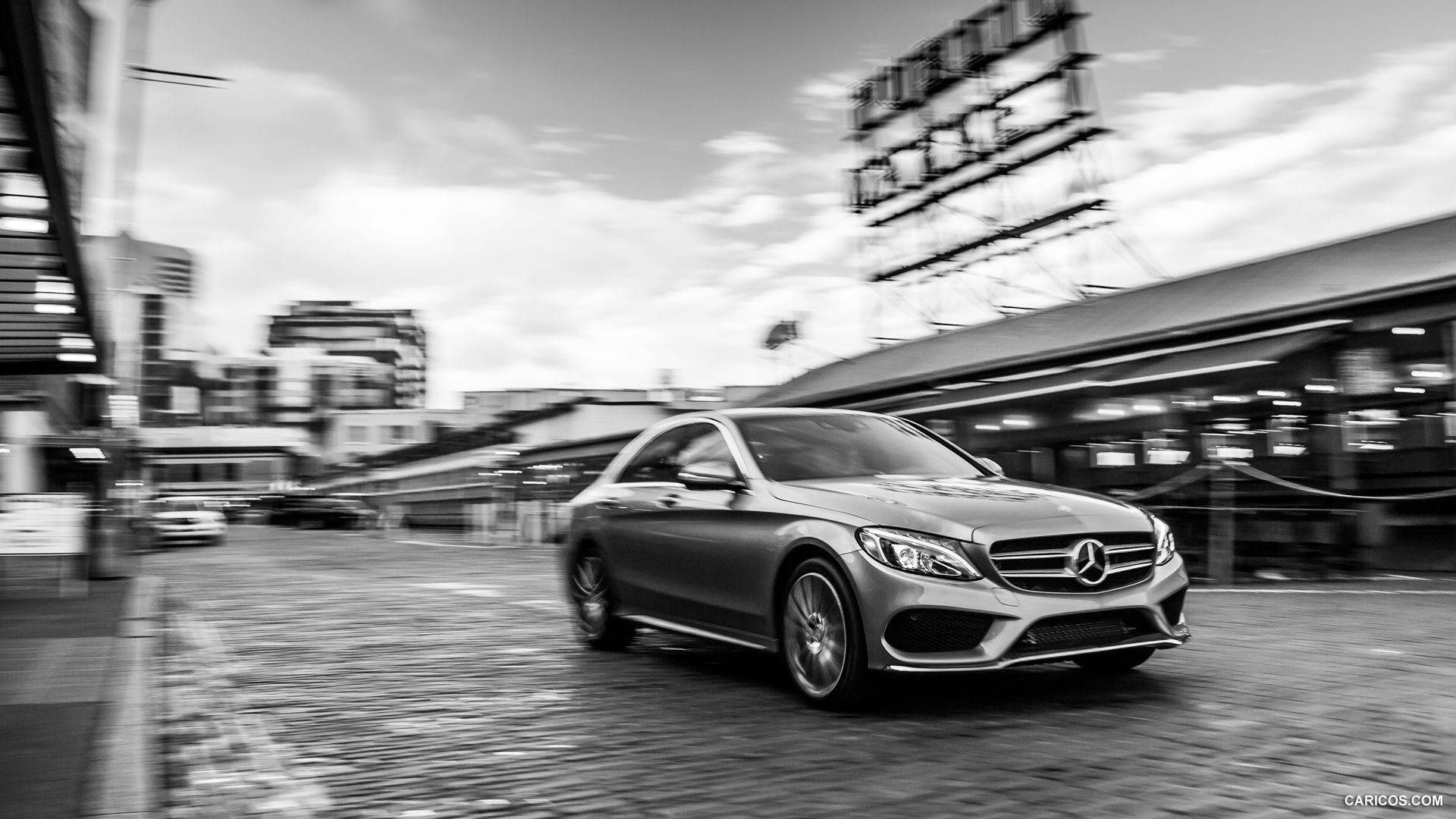 Sleek Mercedes Benz C300 With A Striking City Backdrop Background