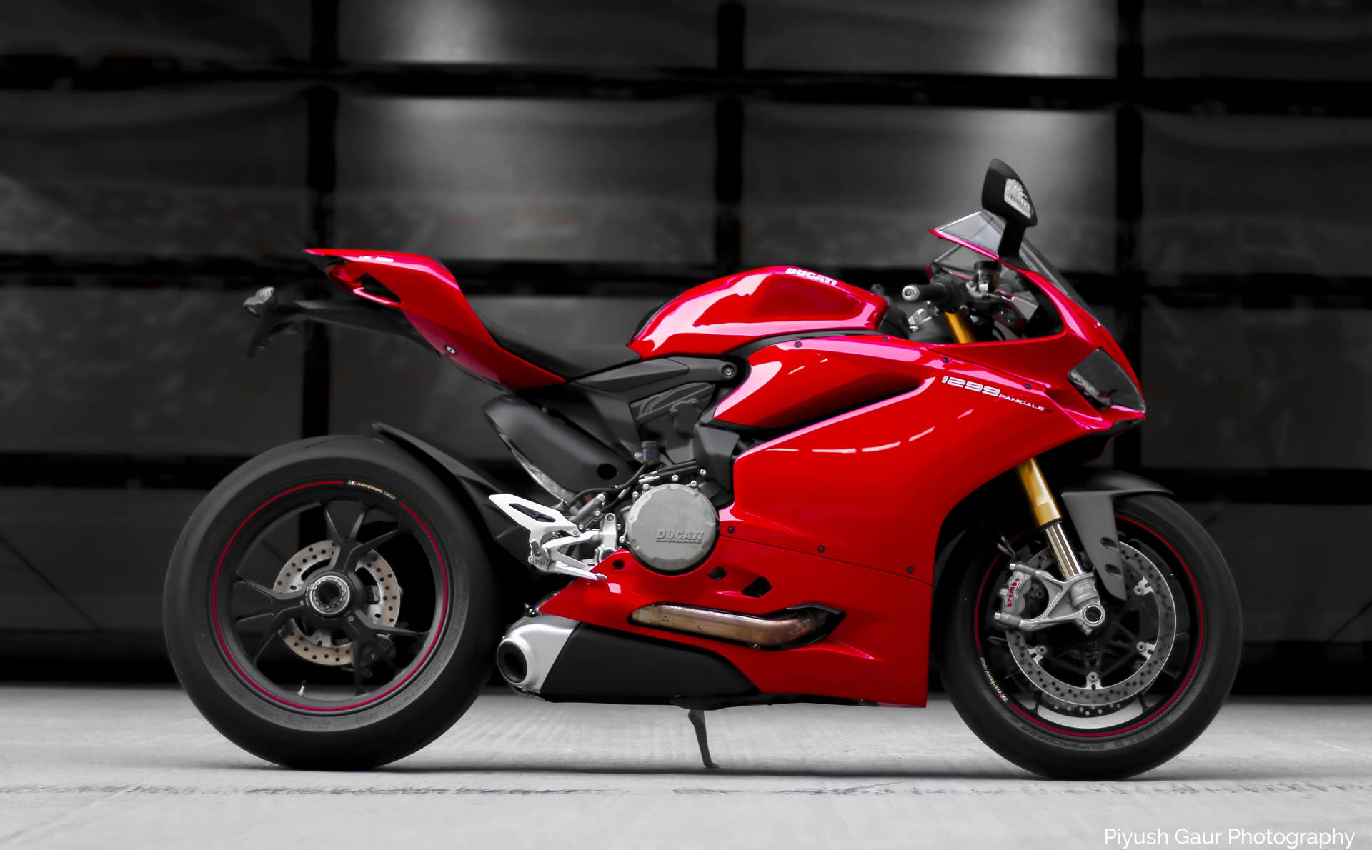 Sleek Red Ducati 1299 Panigale In An Urban Setting Background