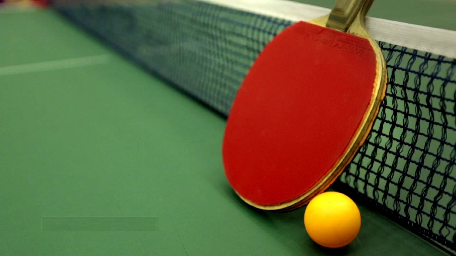 Sleek Table Tennis Ball And Racket Background