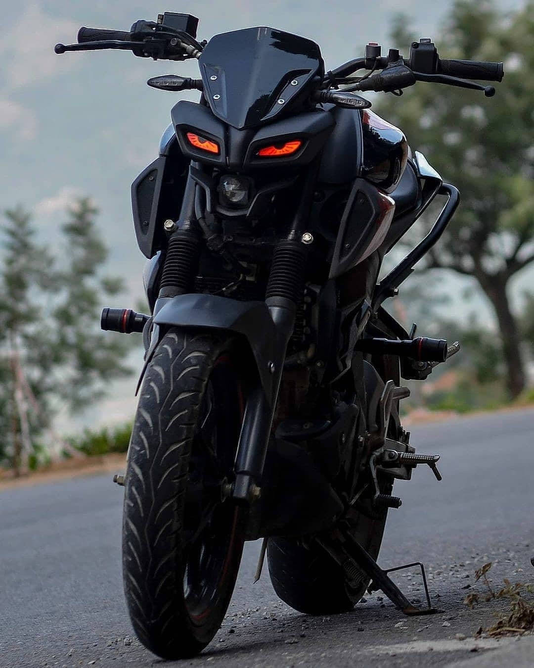Sleek Yamaha Mt 15 Motorcycle In Action Background