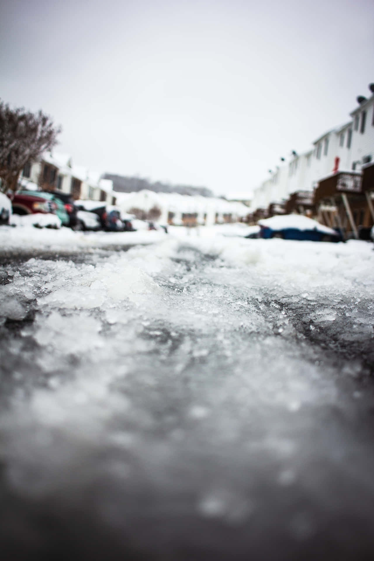 Sleet Covering A Rough Road Background