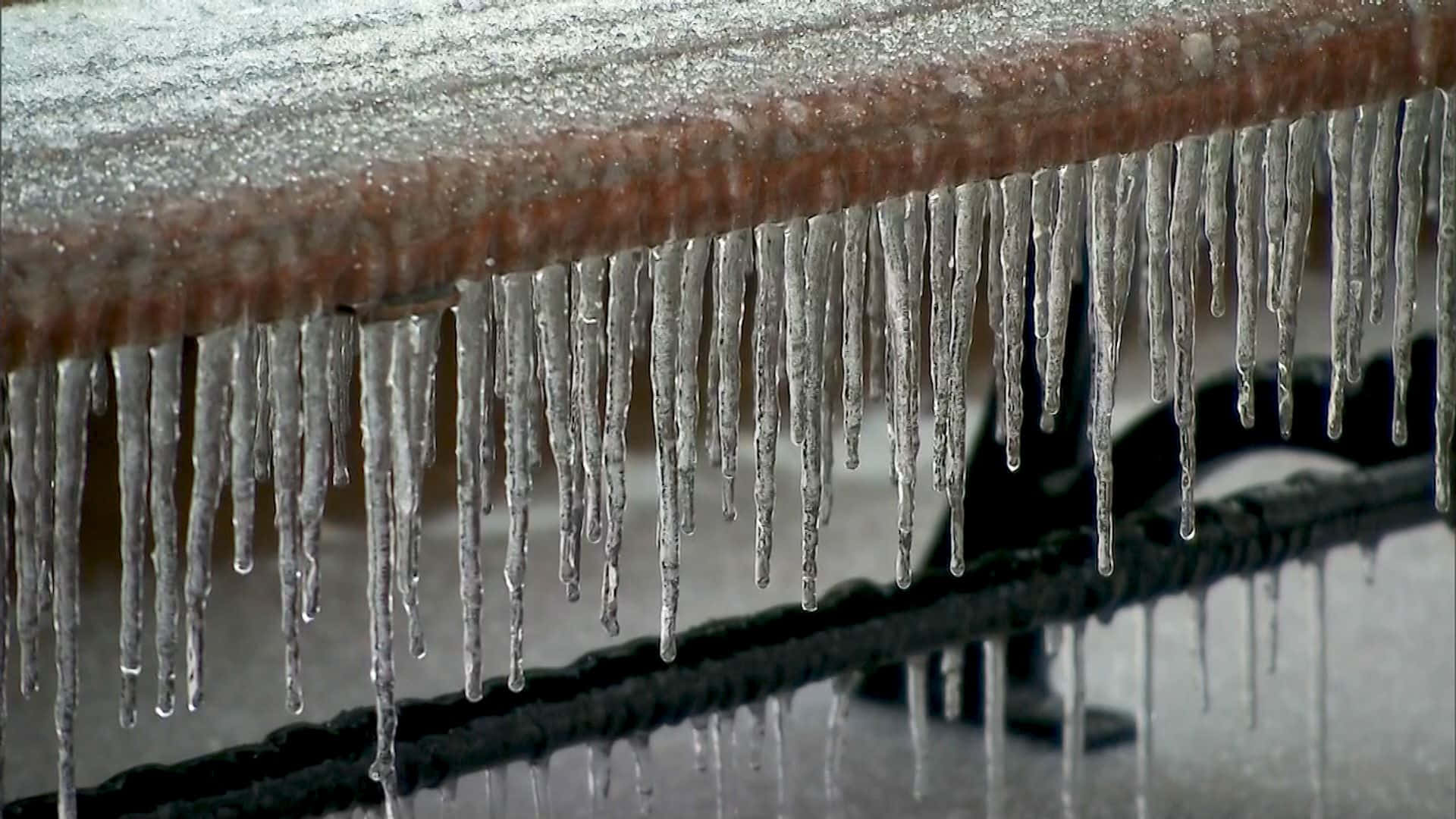 Sleet Forming Under A Wooden Bench Background