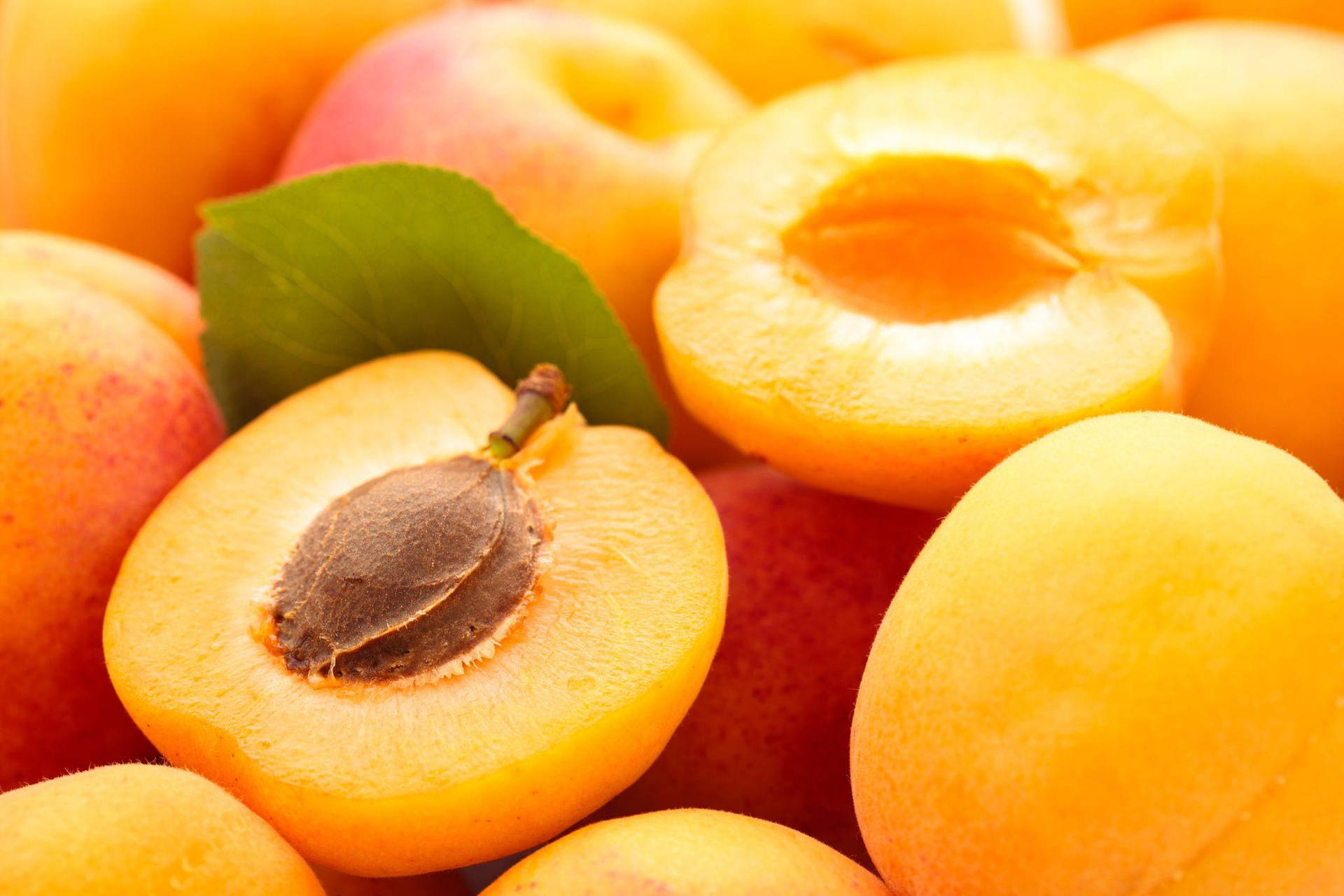 Slice Of Ripe Apricot Fruits With Seed Background