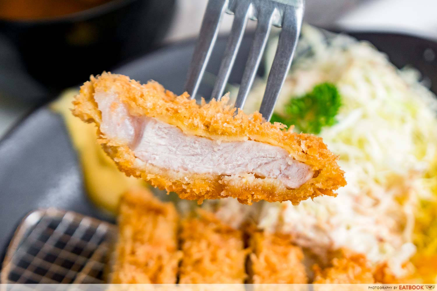 Slice Of Tonkatsu On A Fork Background