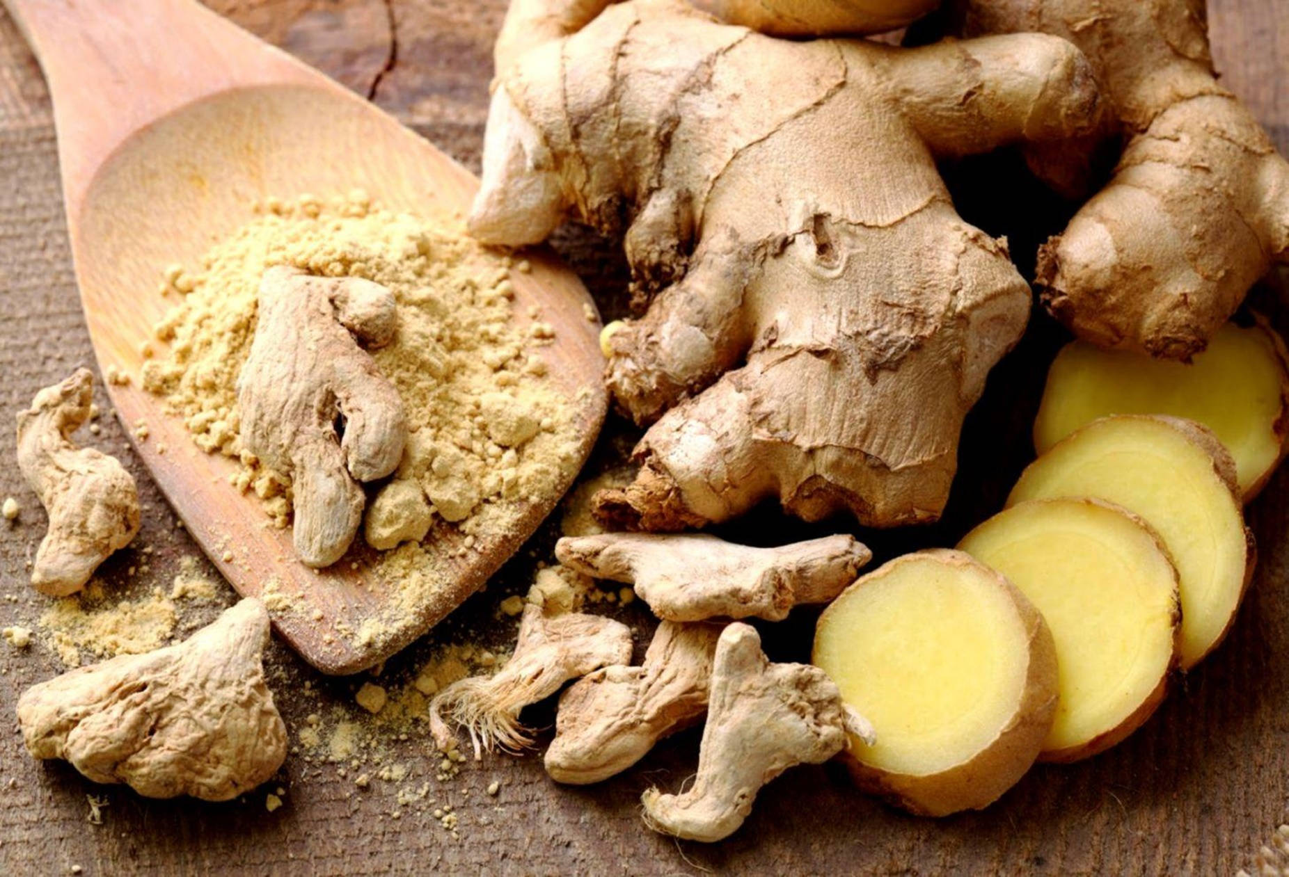 Sliced And Powdered Ginger Root Spice Background