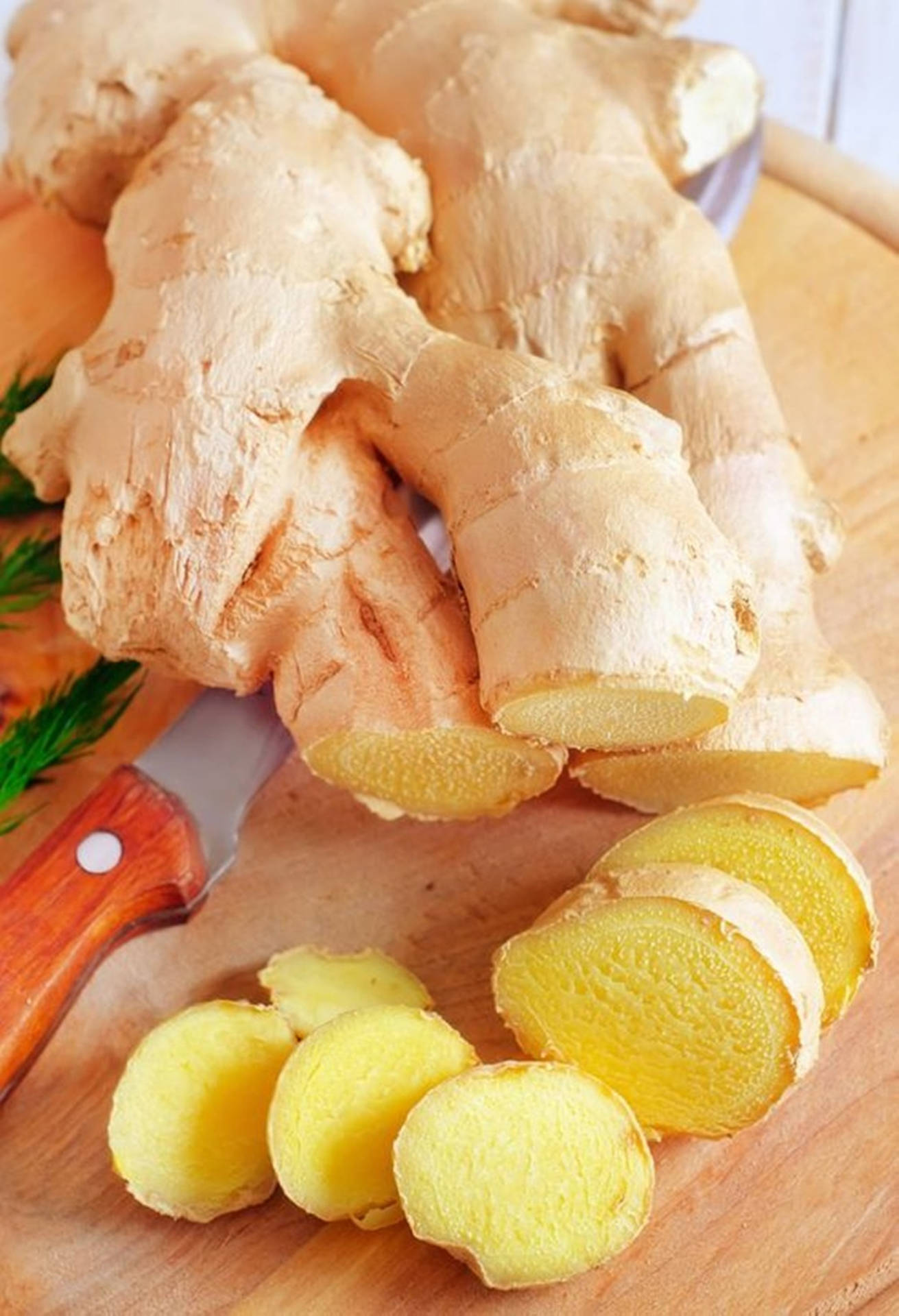 Sliced Ginger Roots Vegetable On Chopping Board Background