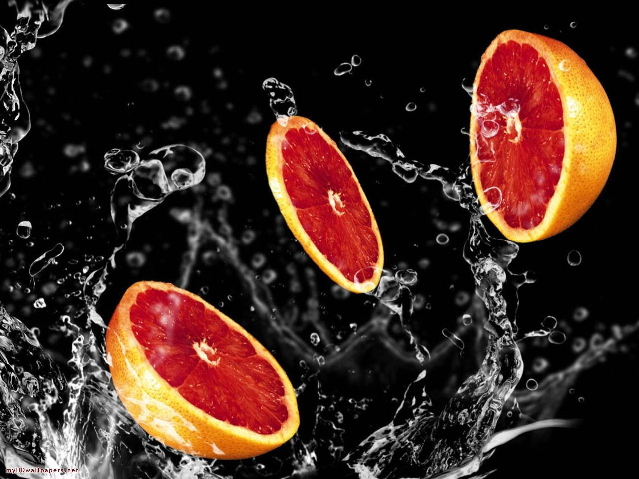 Sliced Grapefruits With Water Splash Background