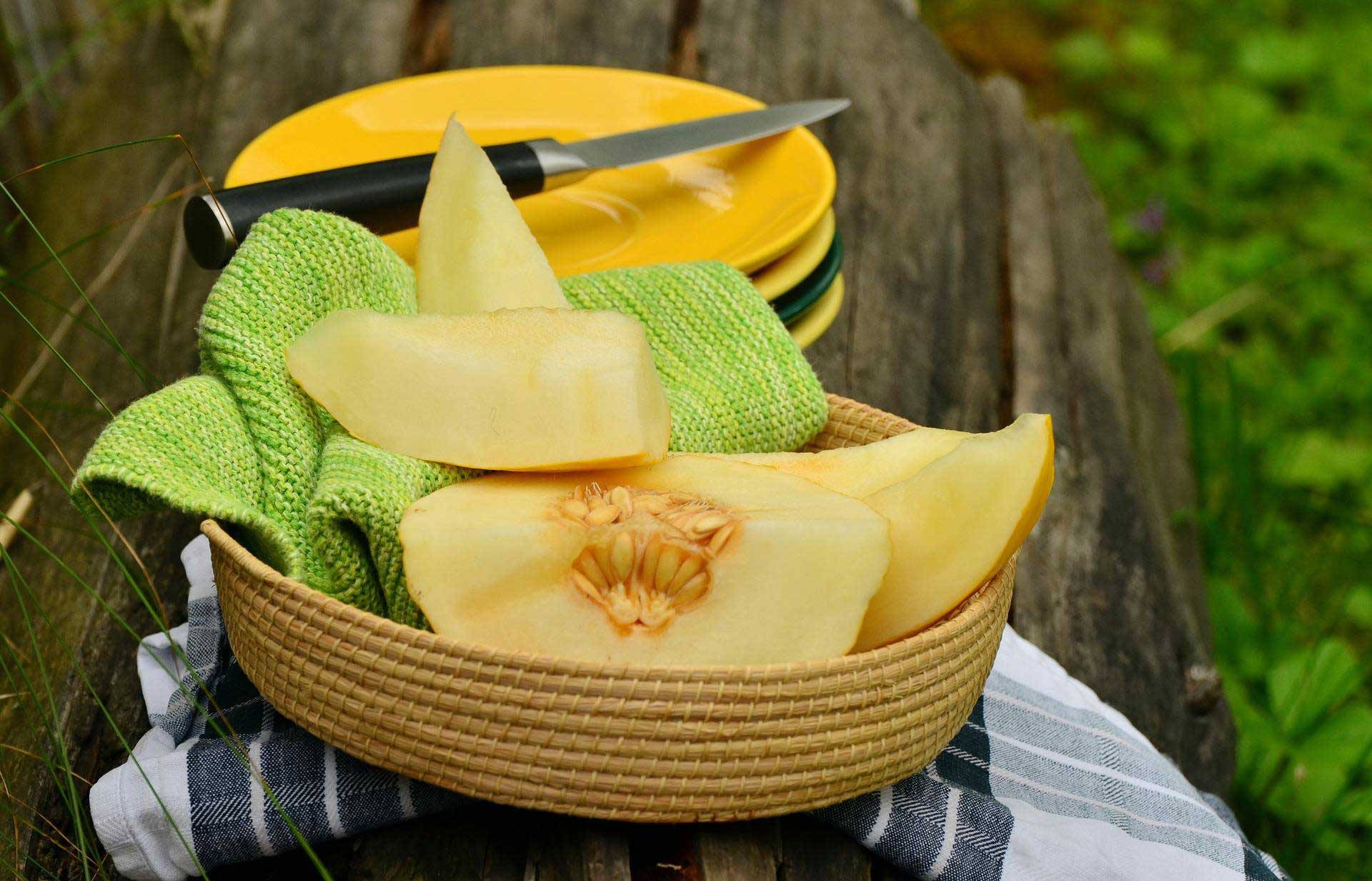 Sliced Honeydew Melon On A Basket Background