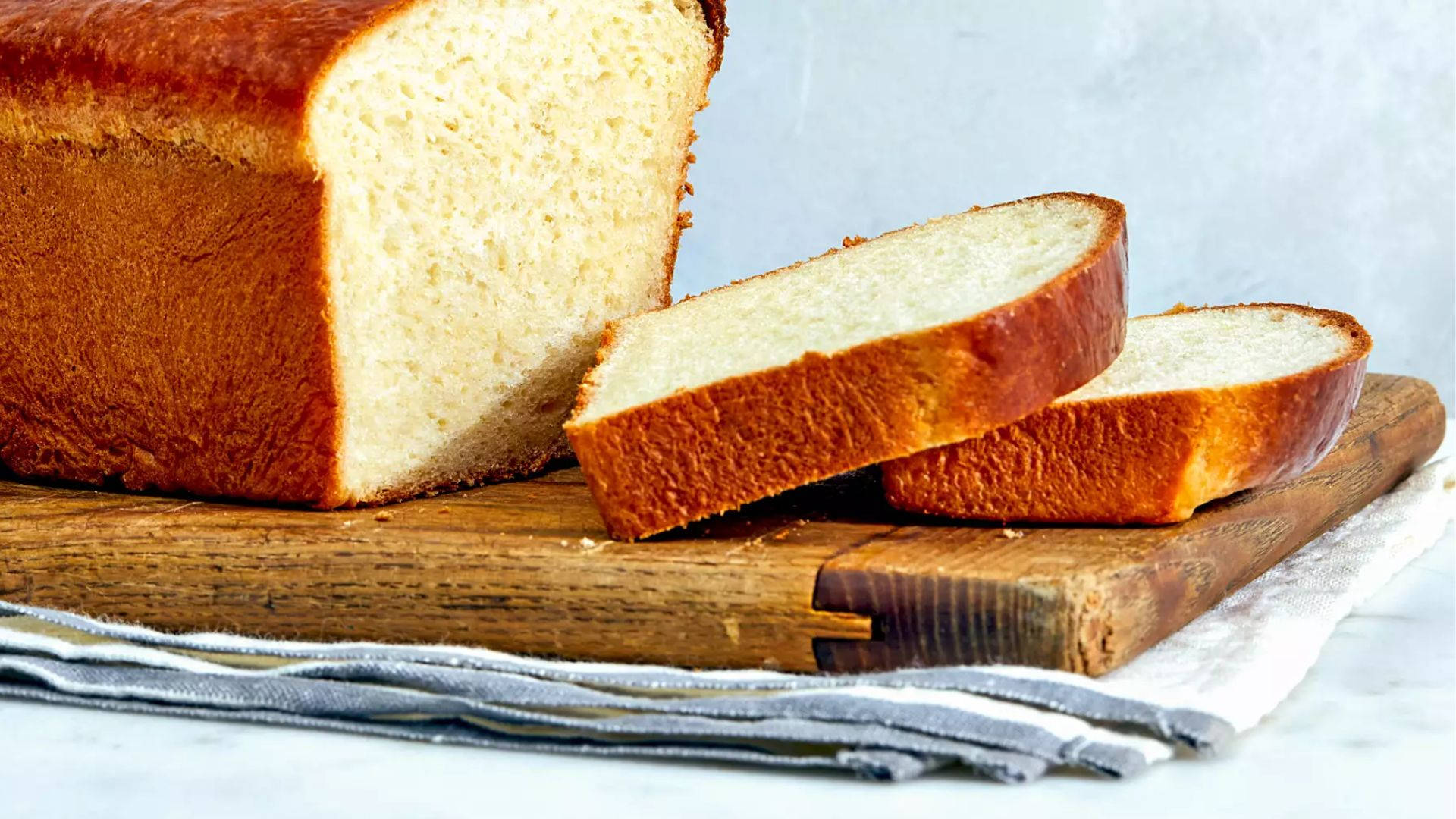 Sliced Loaf Bread On Board Background