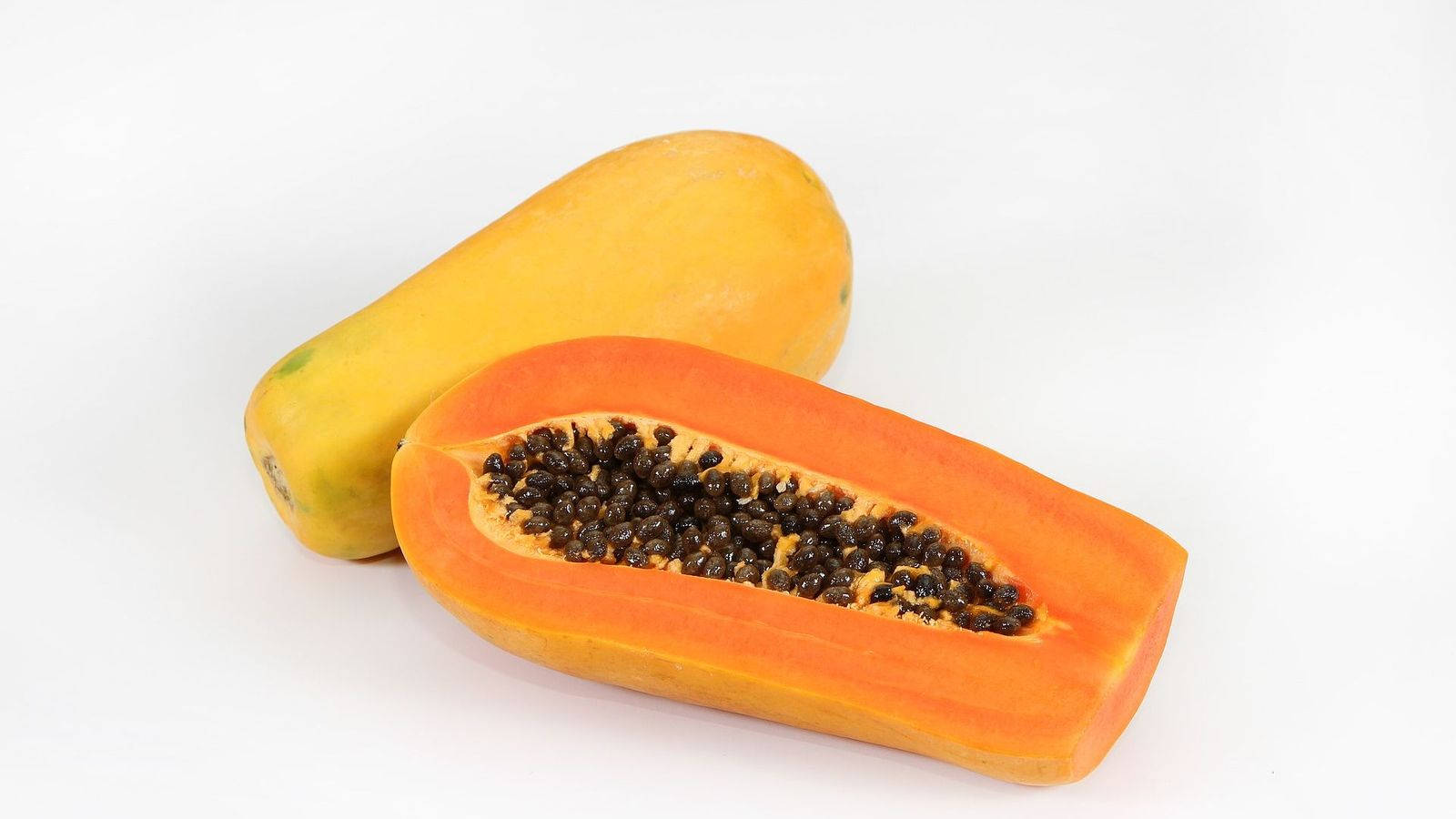 Sliced Papaya Fruits With Seeds White Background