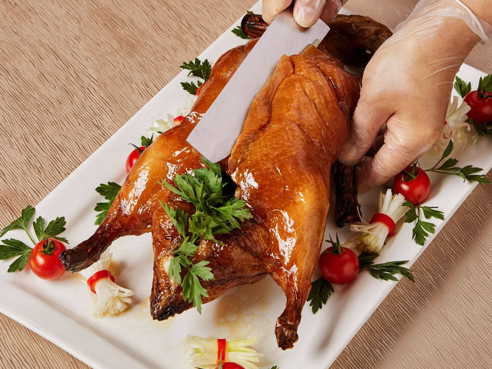 Slicing A Whole Roasted Peking Duck Background