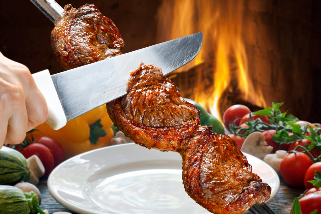 Slicing Churrasco With Knife Background