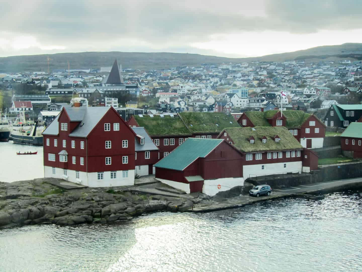 Slightly Foggy Tinganes Peninsula At Thorshavn Background