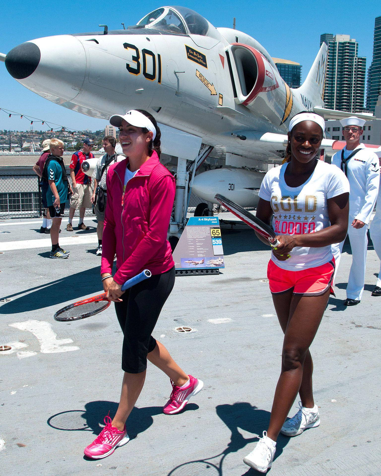 Sloane Stephens And An A-4 Skyhawk Aircraft Background