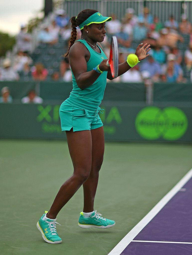 Sloane Stephens In Action With Her Green Tennis Outfit Background