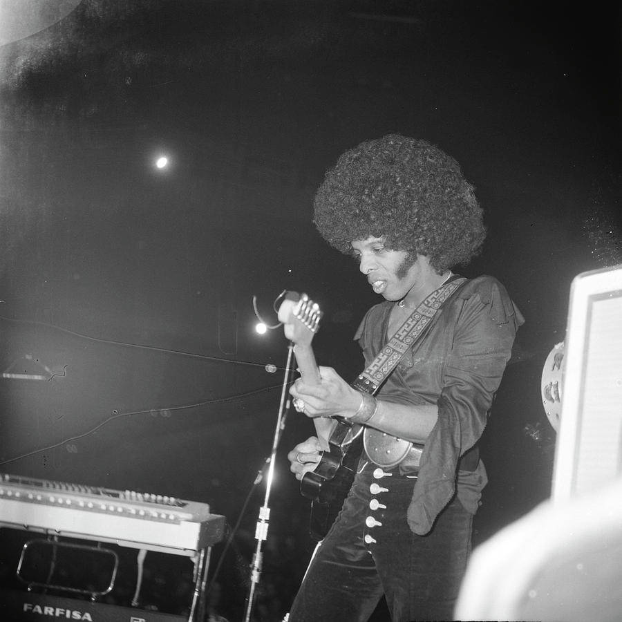 Sly And The Family Stone On Stage Background