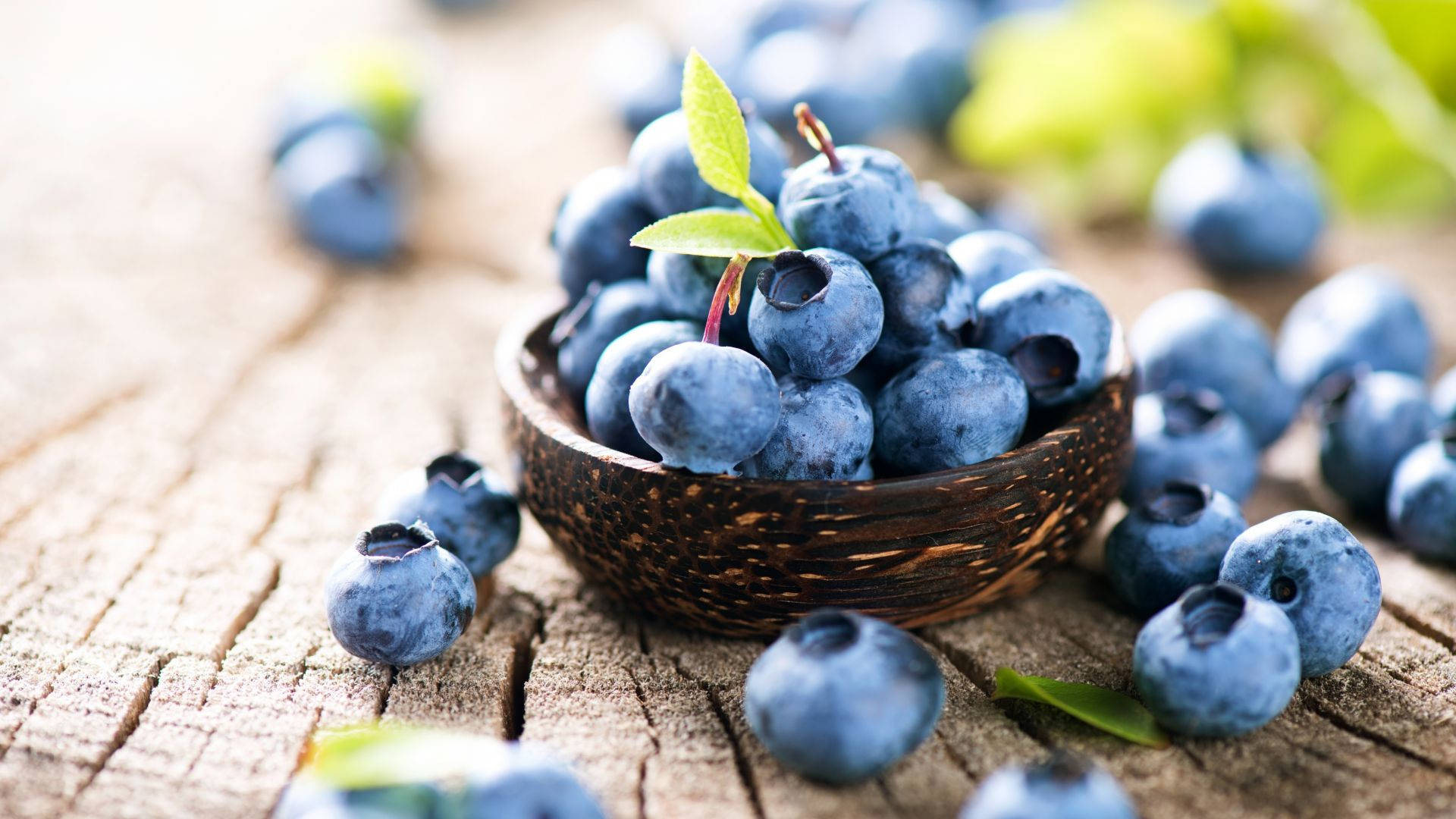 Small Basket Of Blueberries On A Plank Background