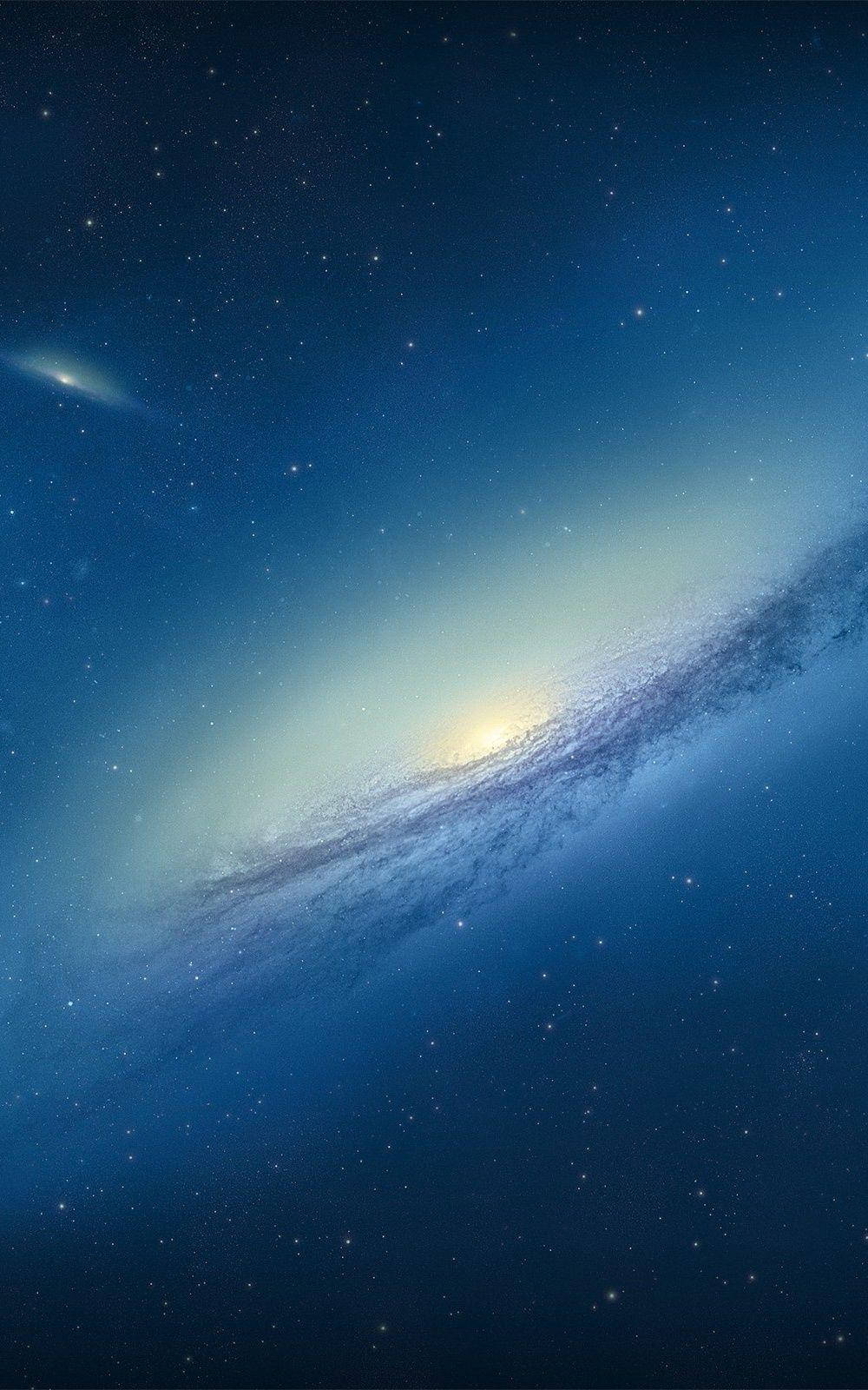 Small Blue Galaxy In Outer Space Background