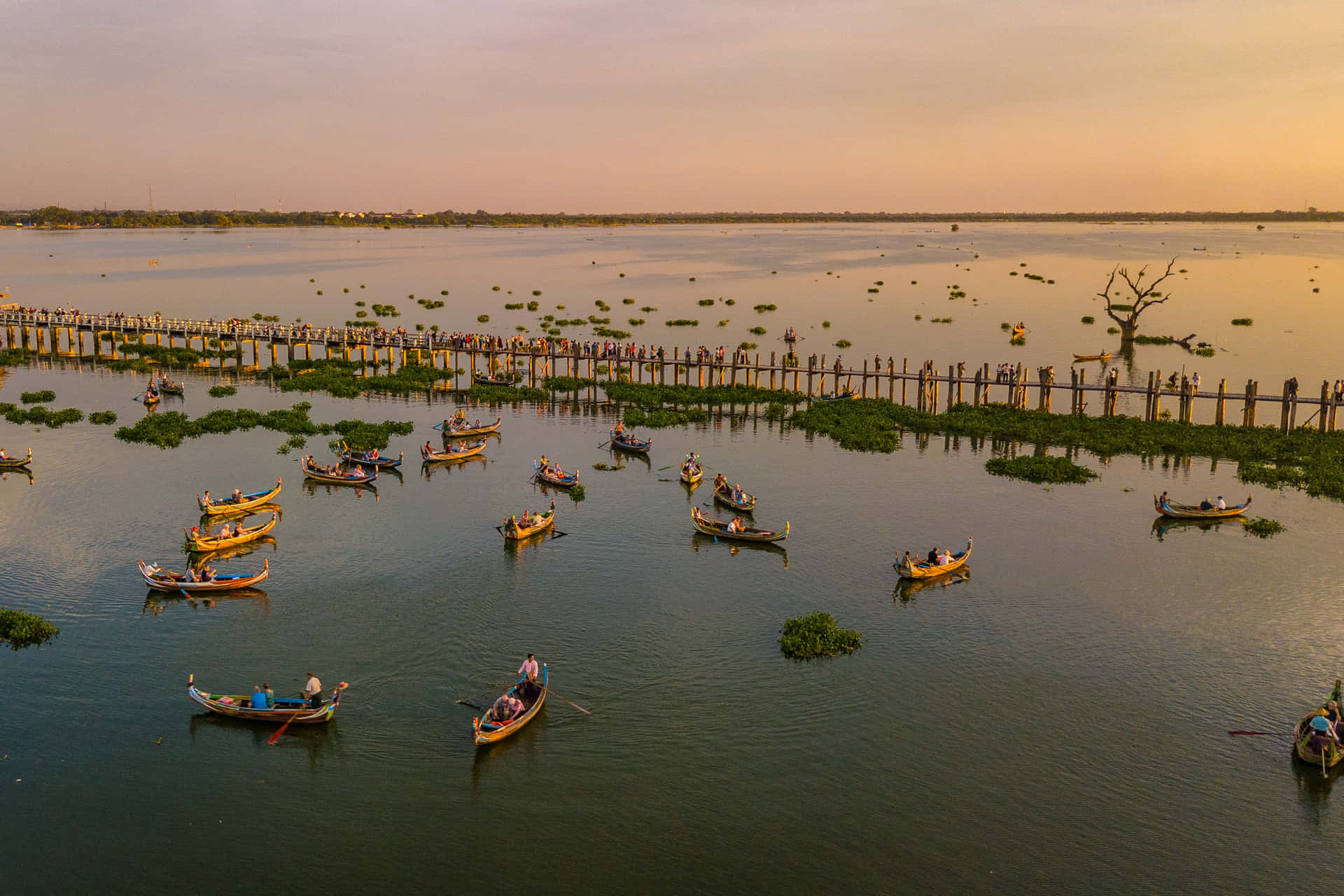 Small Boats Sailing In The Taungthaman Lake In Mandalay