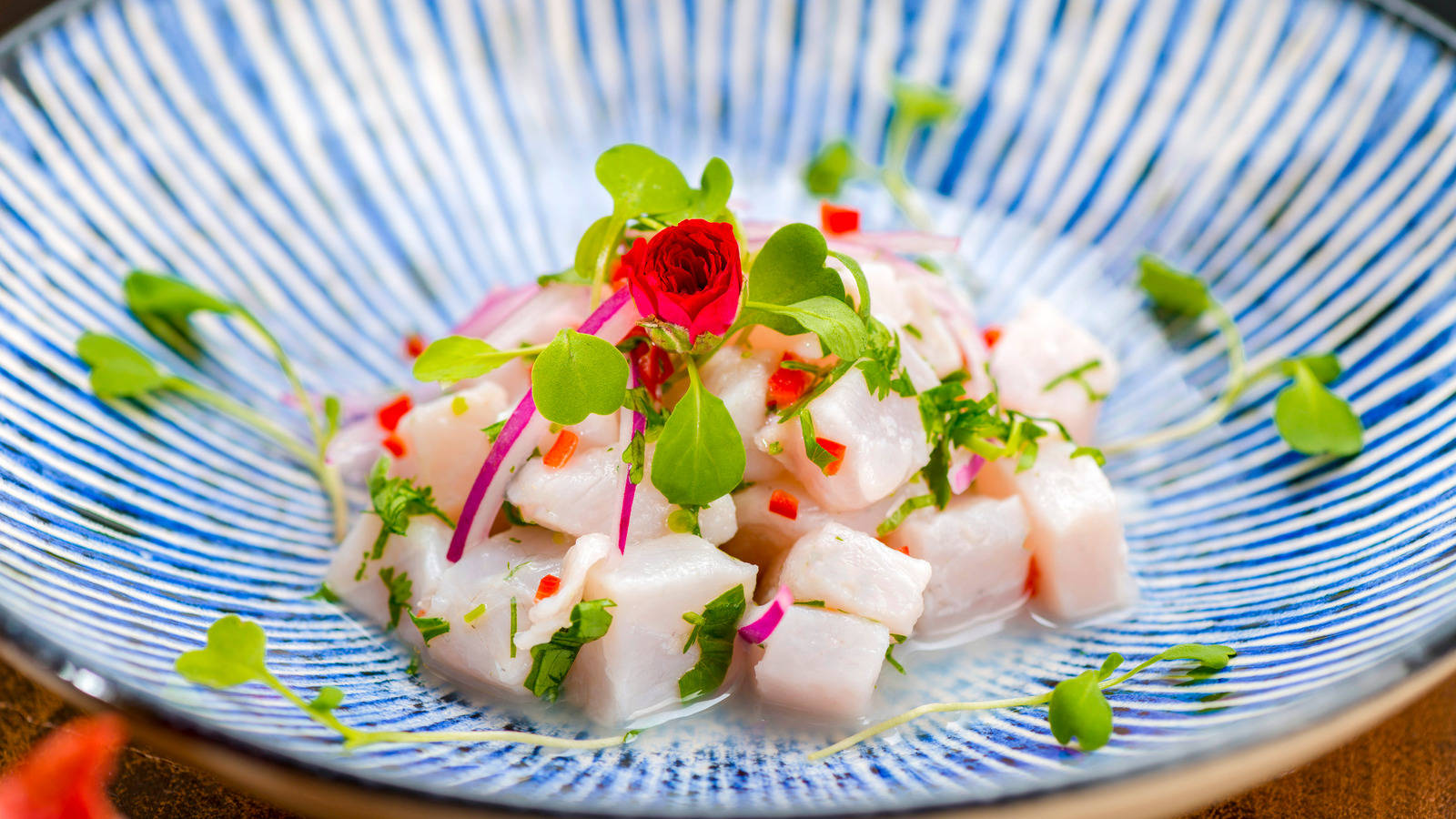 Small Serving Of Ceviche On Blue Bowl Background