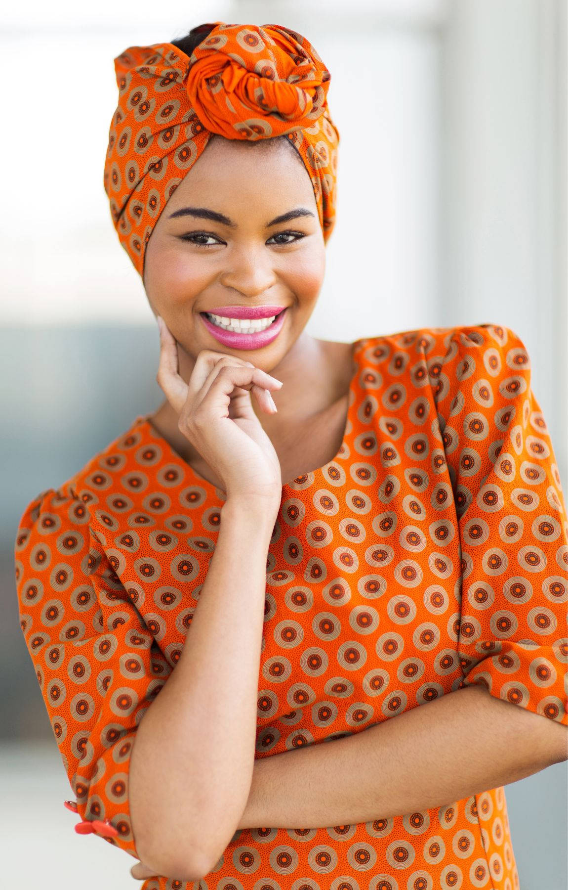 Smiling African Woman Hands On Chin Background