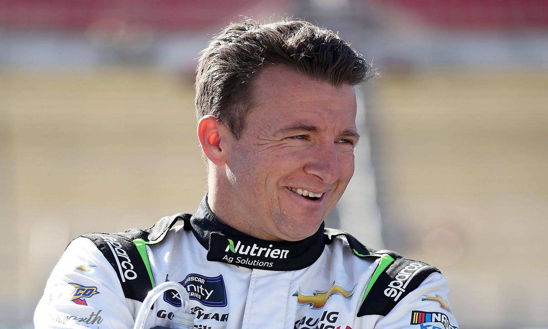 Smiling Aj Allmendinger After Race Background