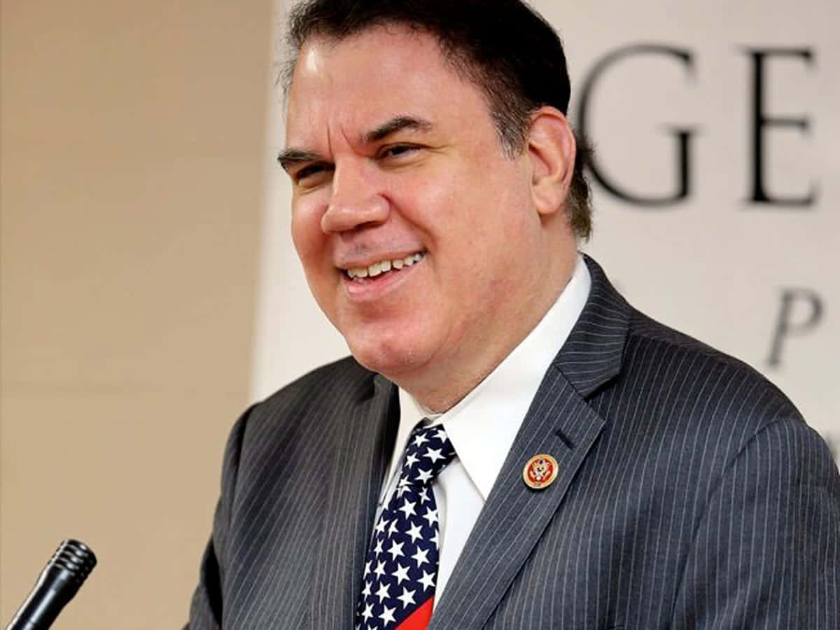 Smiling Alan Grayson Speaker Background