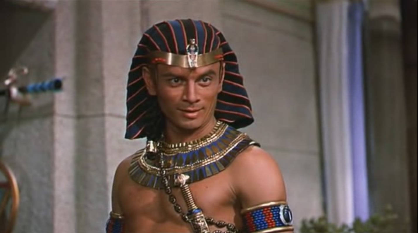 Smiling American Actor Yul Brynner As Pharaoh Ramses Background