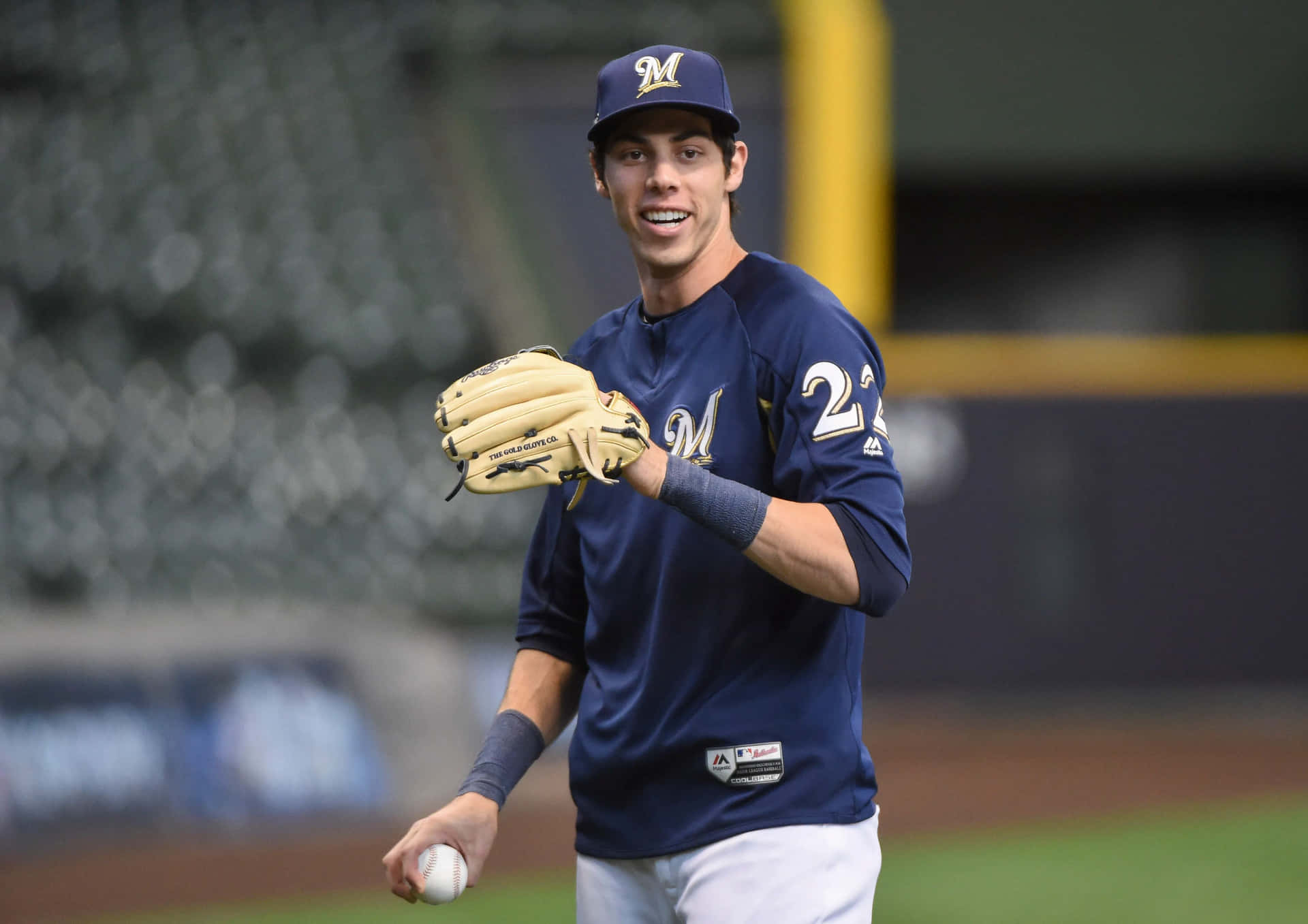 Smiling Baseball Player Wearing Number22 Background