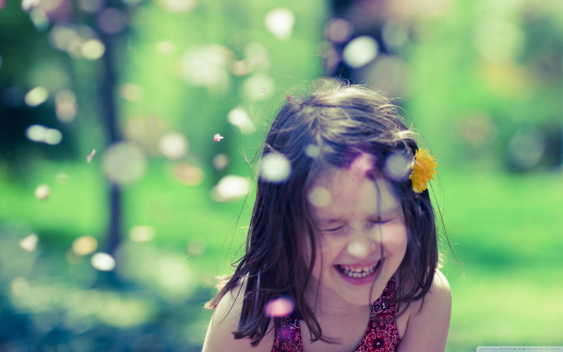 Smiling Child Confetti In Bokeh Effect