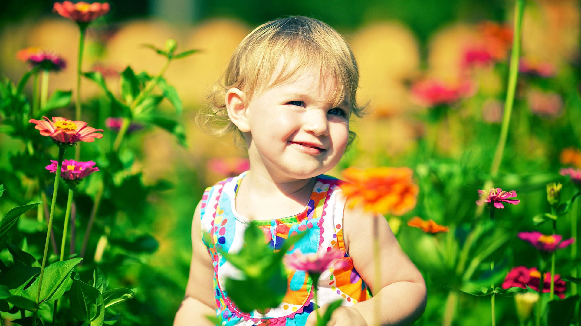 Smiling Child In A Flower Garden