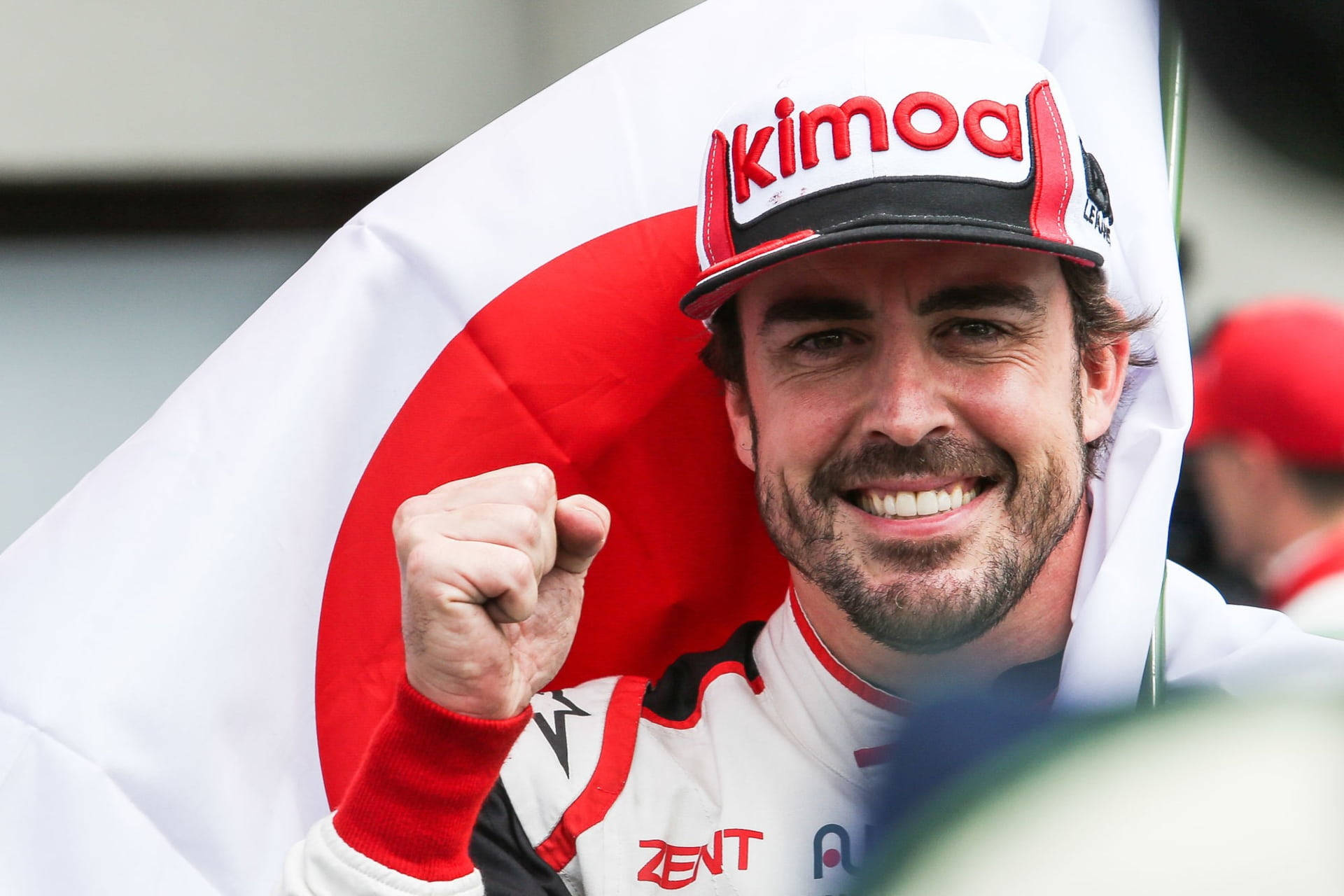 Smiling Fernando Alonso Closed Fist Background