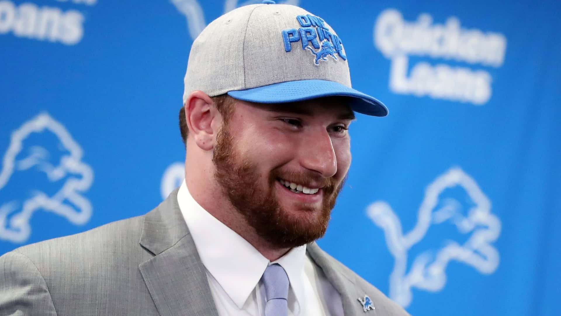 Smiling Frank Ragnow In Formal Attire Background